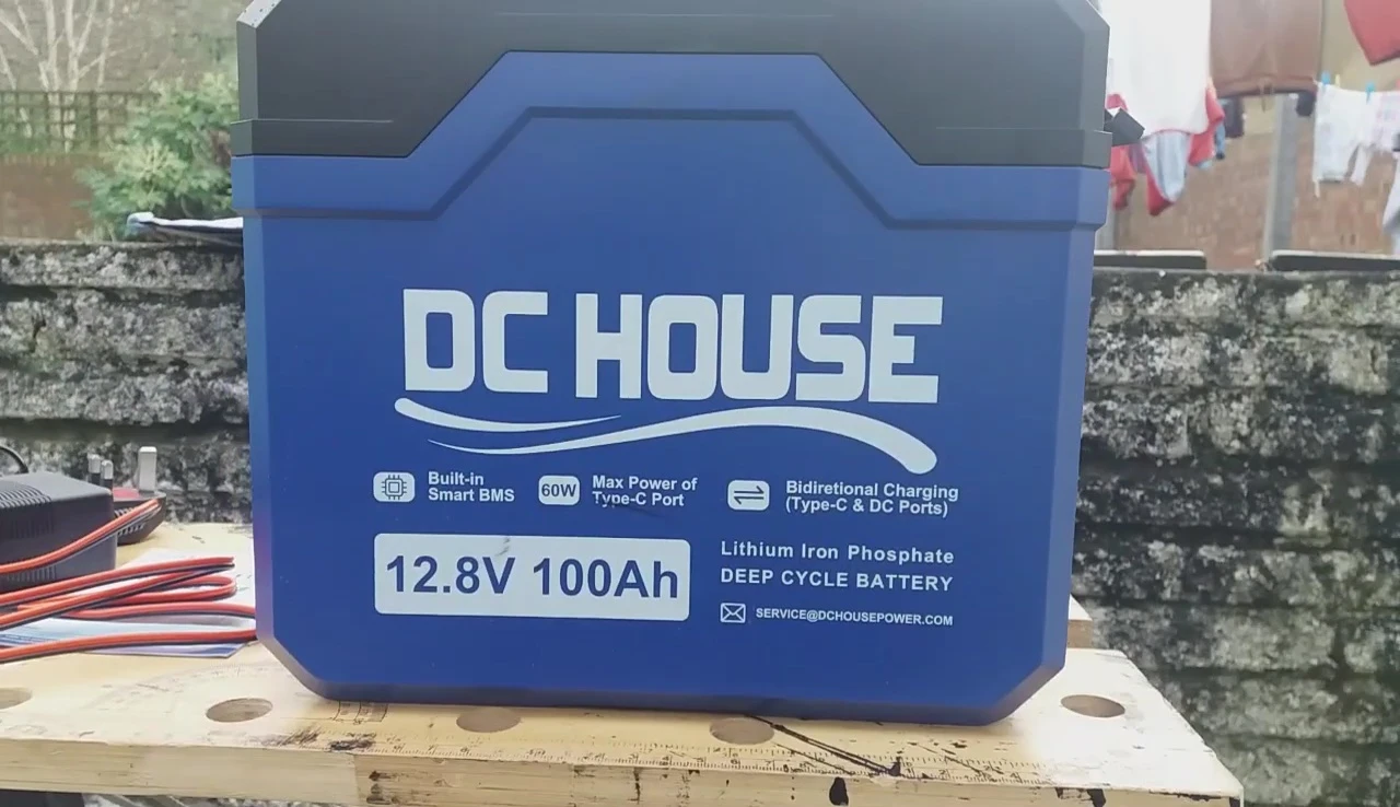 Close-up of the DC House LifePo4 battery showing its various ports and outputs.