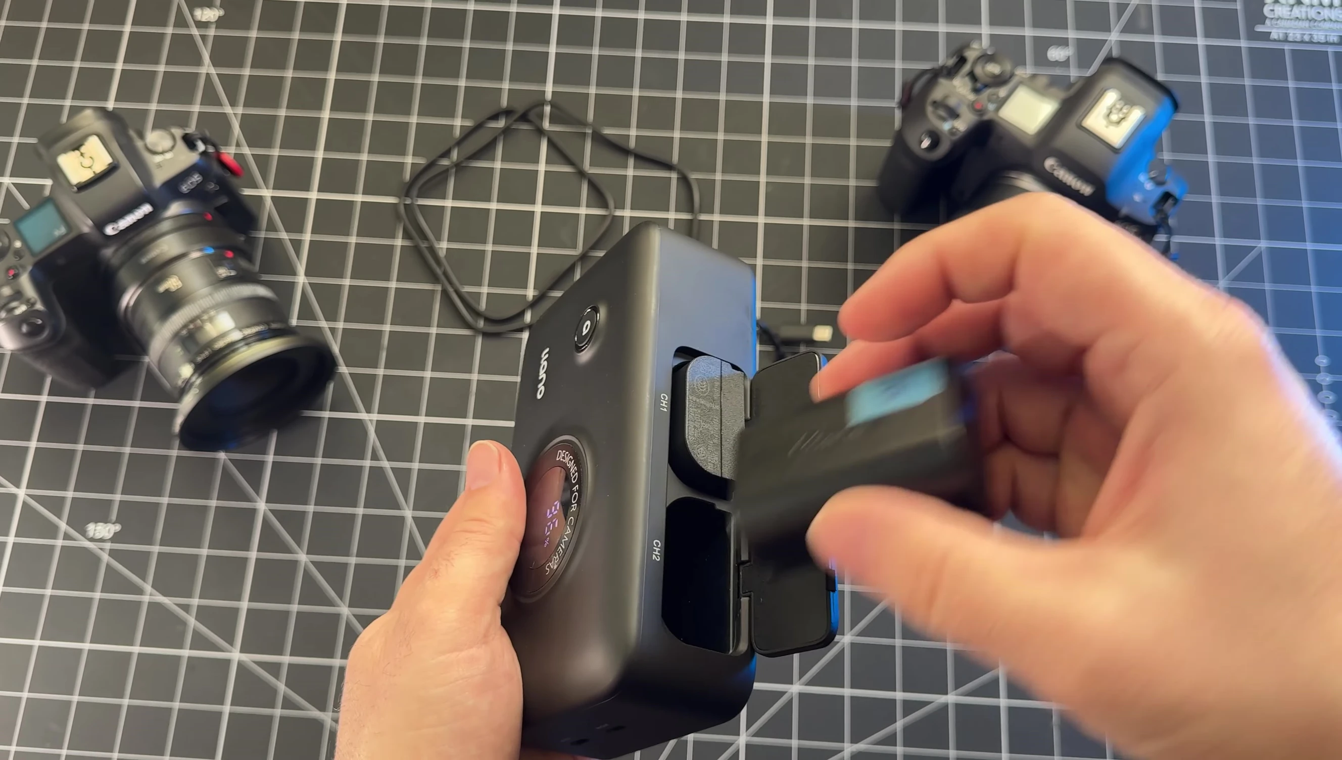 Close-up shot of the single button on the LLANO charger.