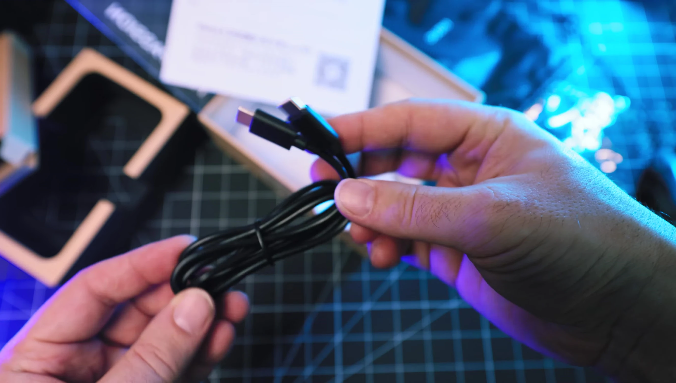 The USB cable and carrying pouch included with the LLANO charger.