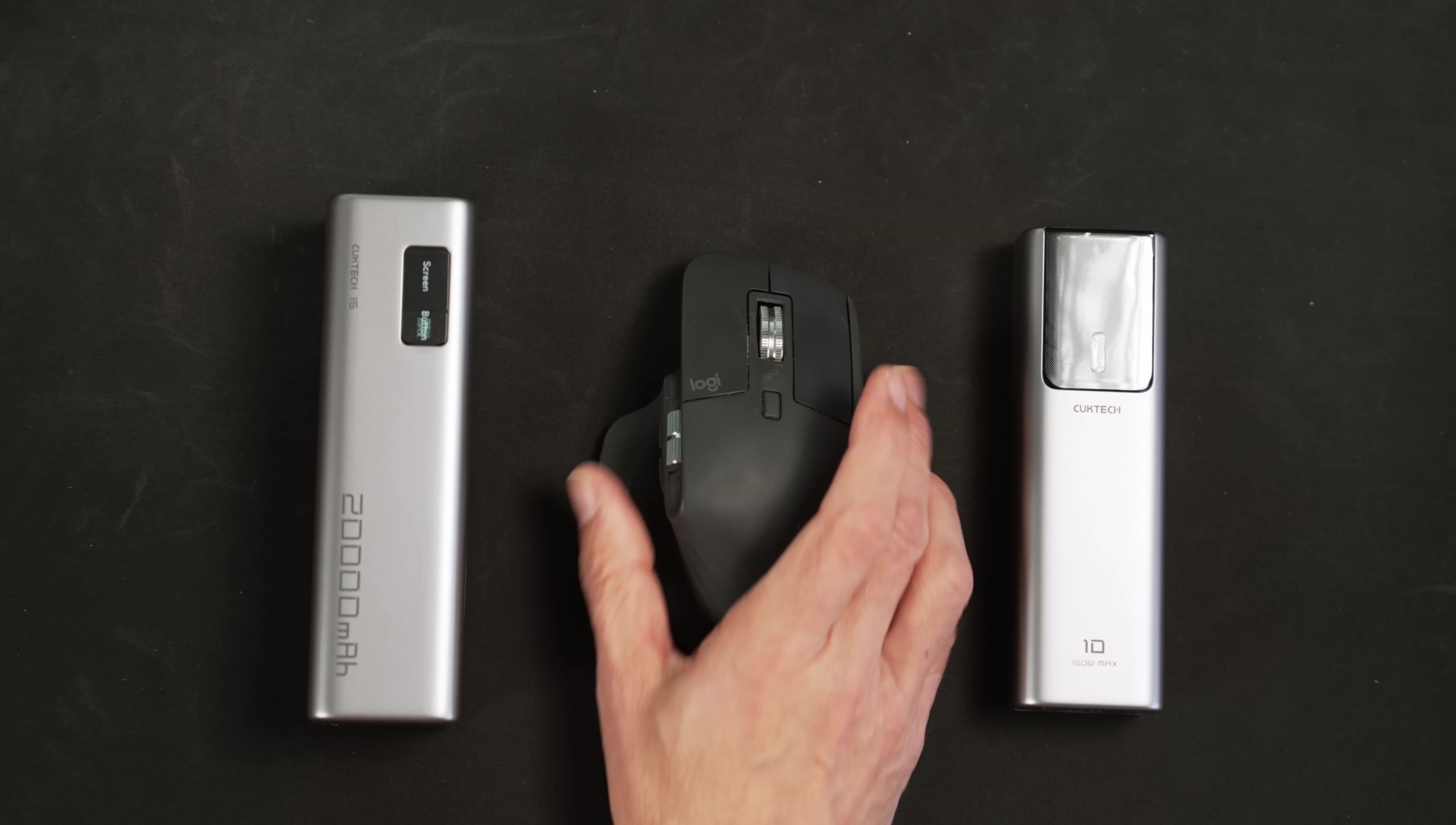 Size comparison with a smartphone and mouse.