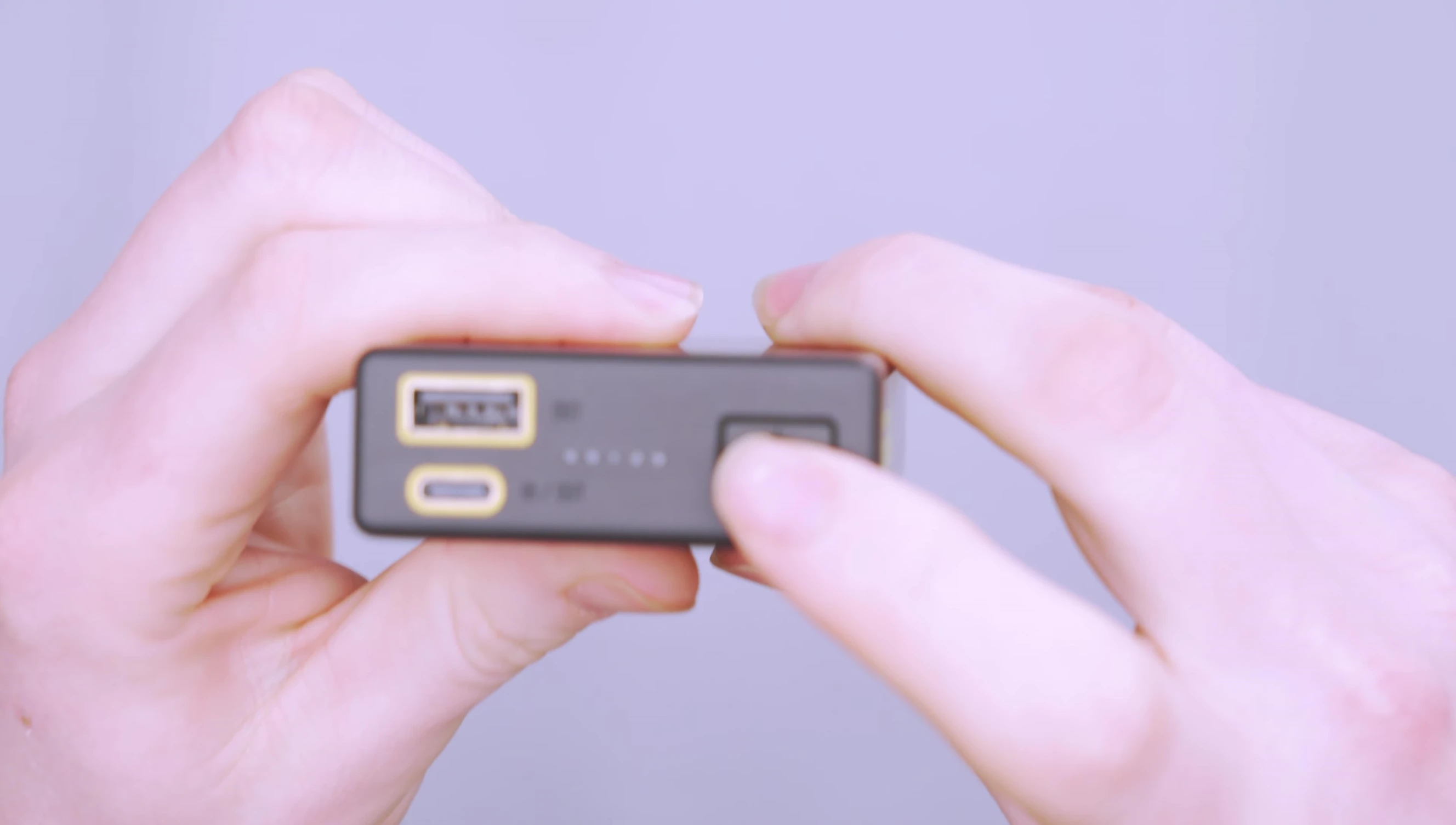 The power button and LED indicators on the NITECORE Carbo 20000.