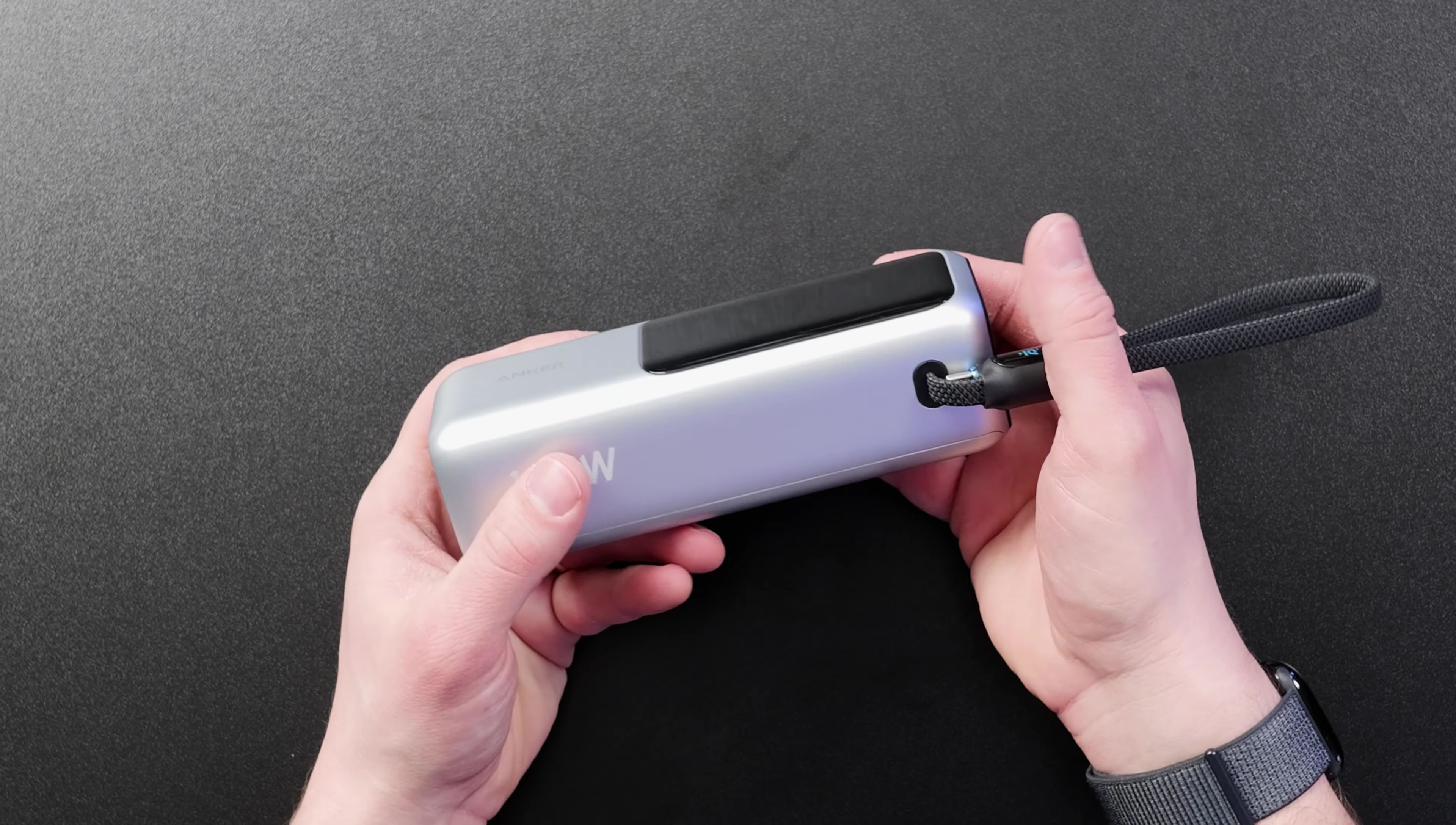 Close-up of the Anker 165W power bank showcasing its sleek design and display screen.