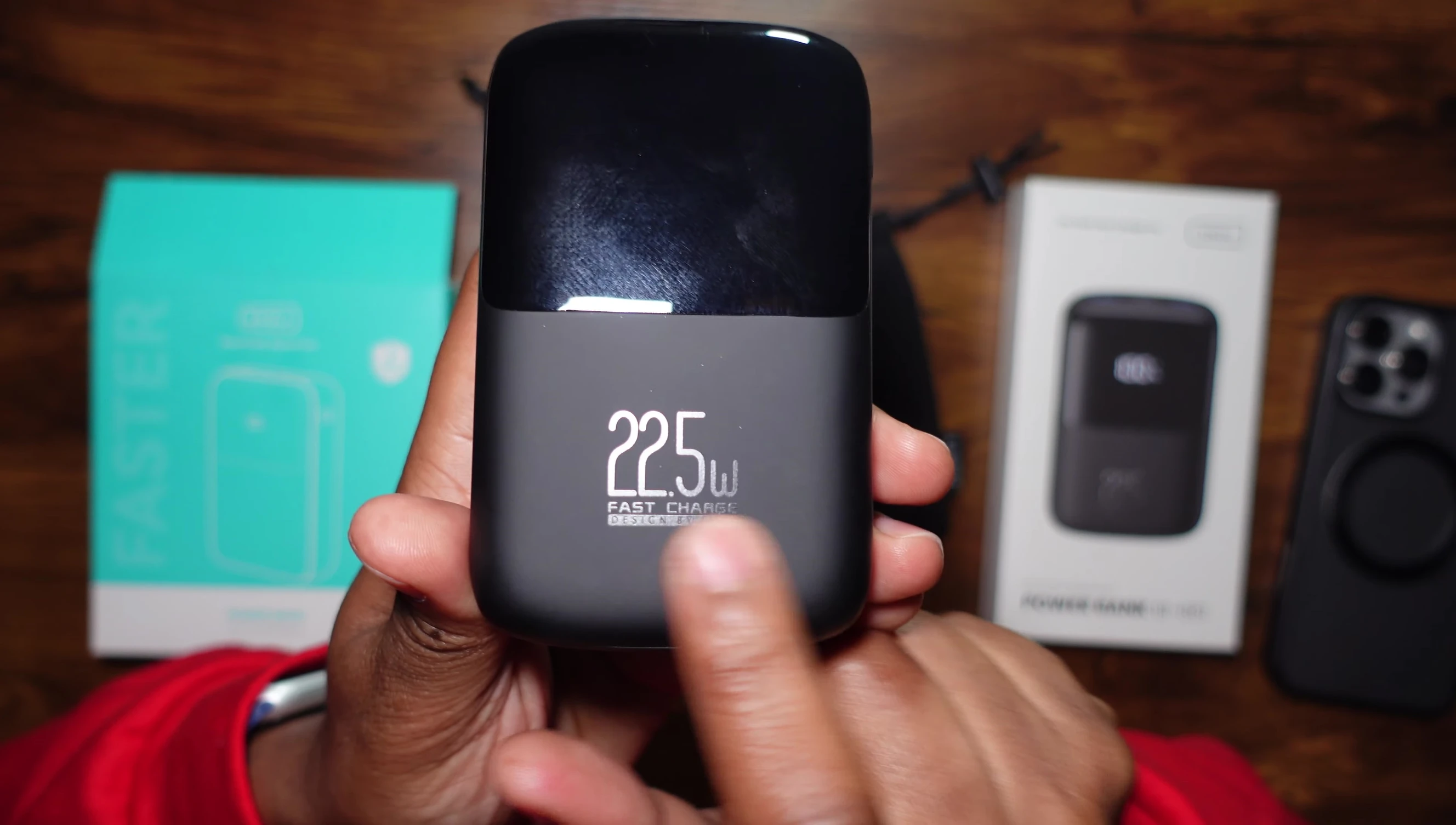 Close-up of the smaller power bank's ports and charging indicator.