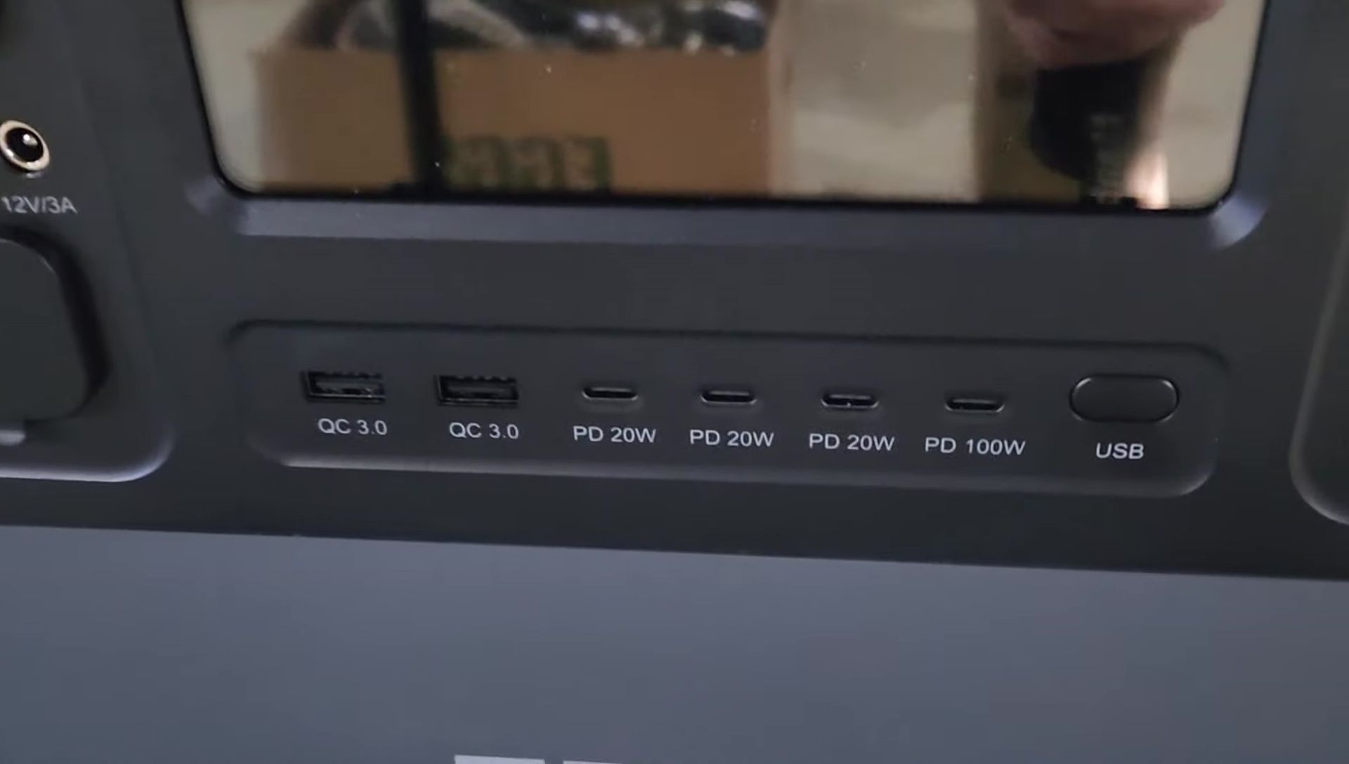 Close-up of the AFERIY power station showing its numerous ports and outlets.