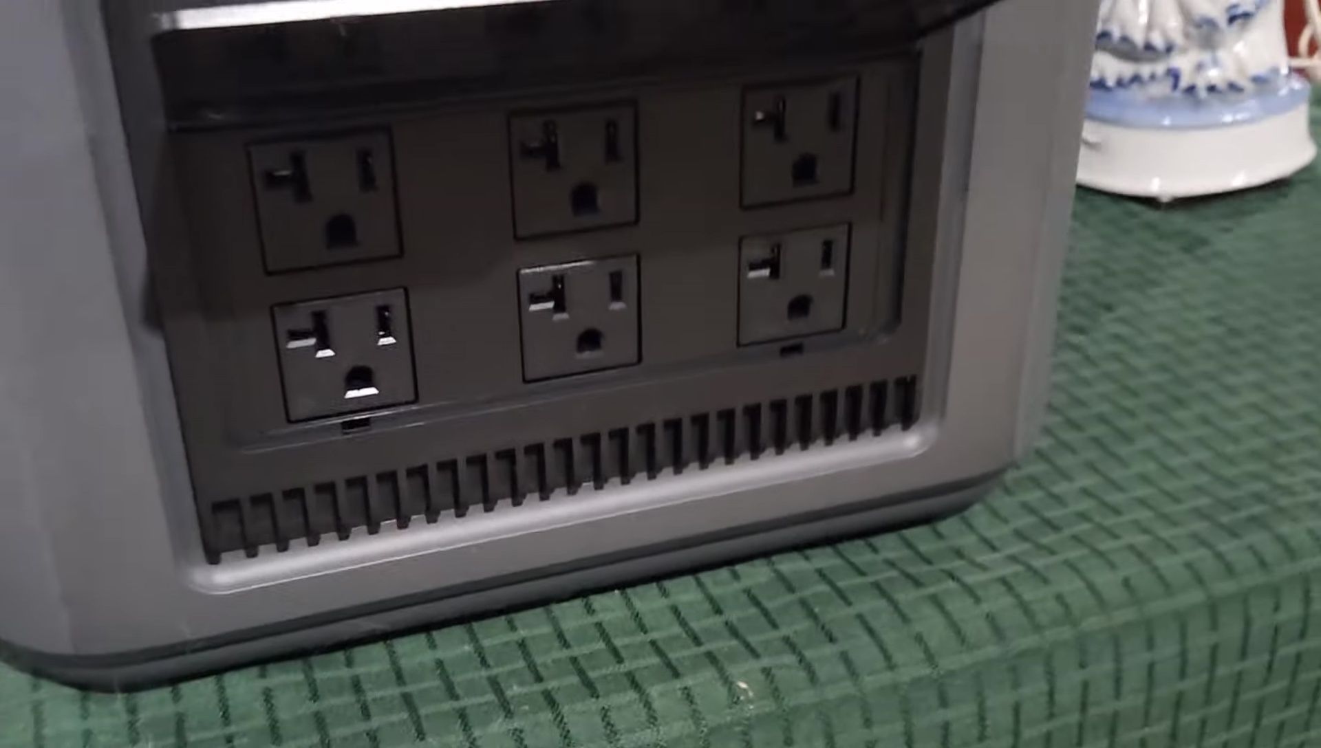 The side compartment revealing the six AC outlets.