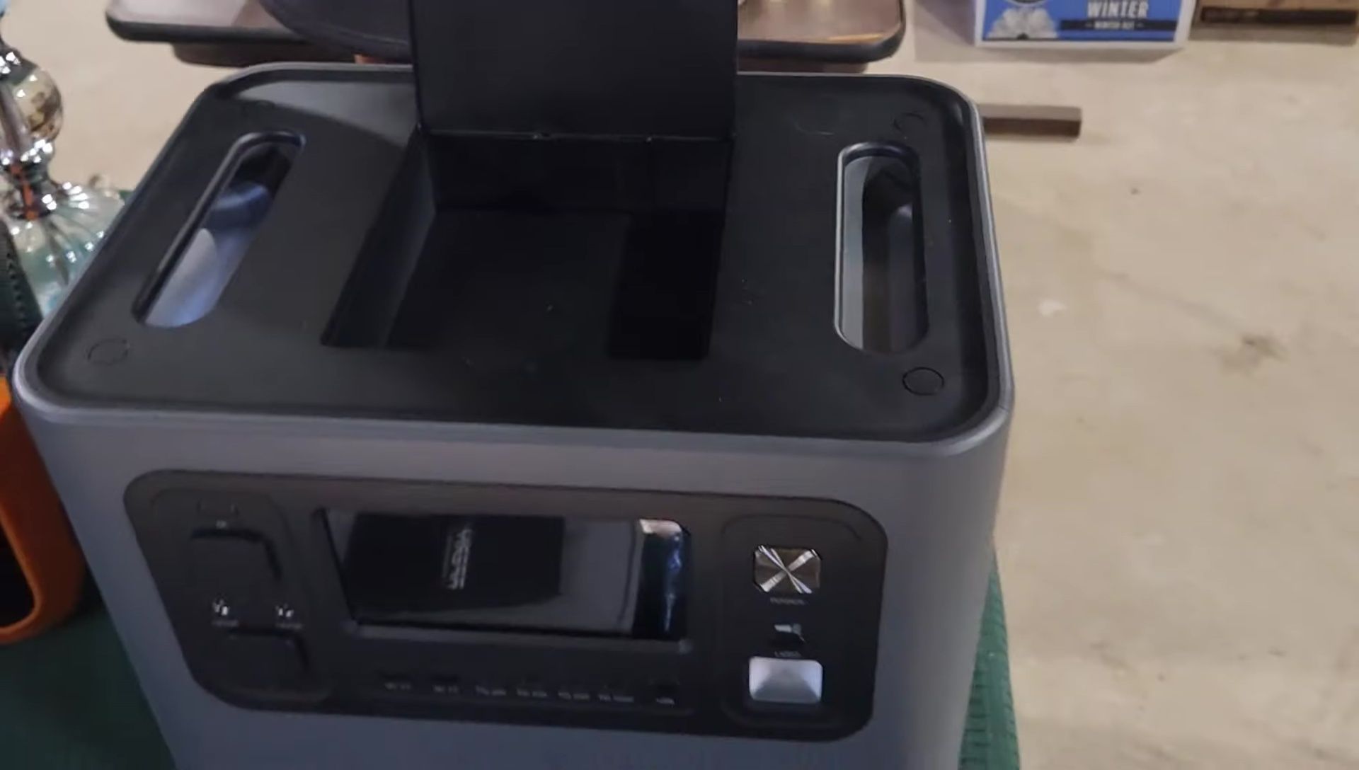 The top compartment for storing cables and accessories.