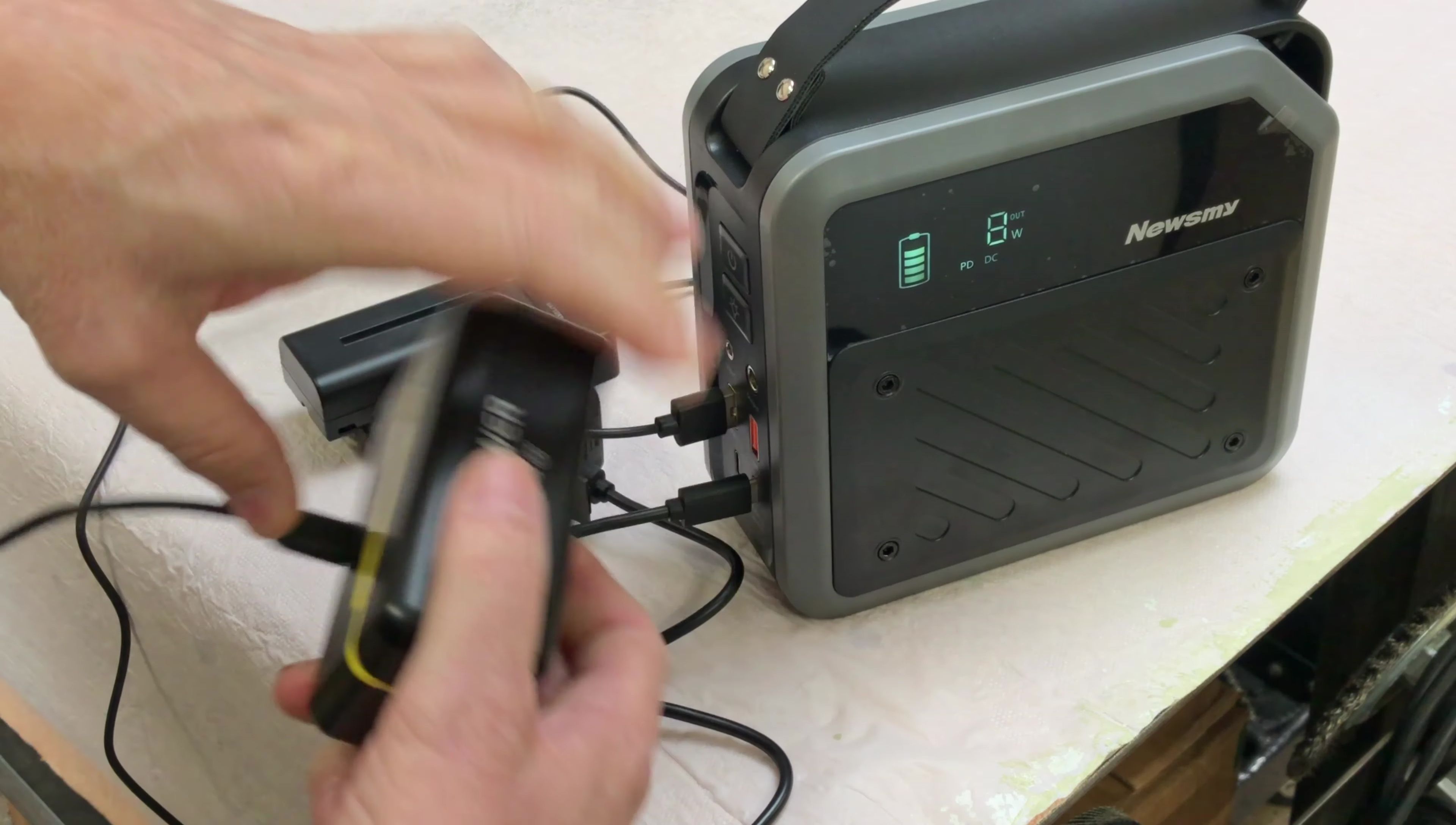 Charging a wireless microphone and fan