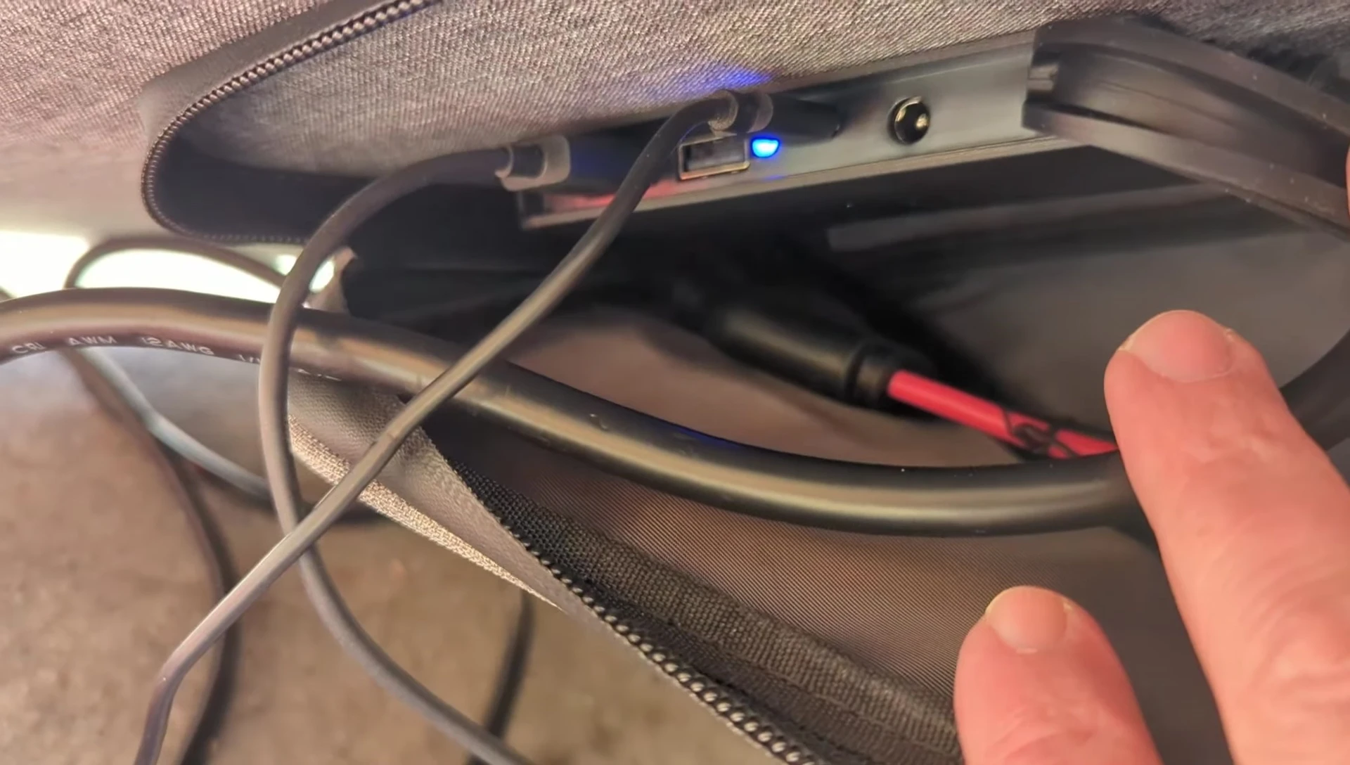 Close-up shot showing the various charging ports on the solar panel.