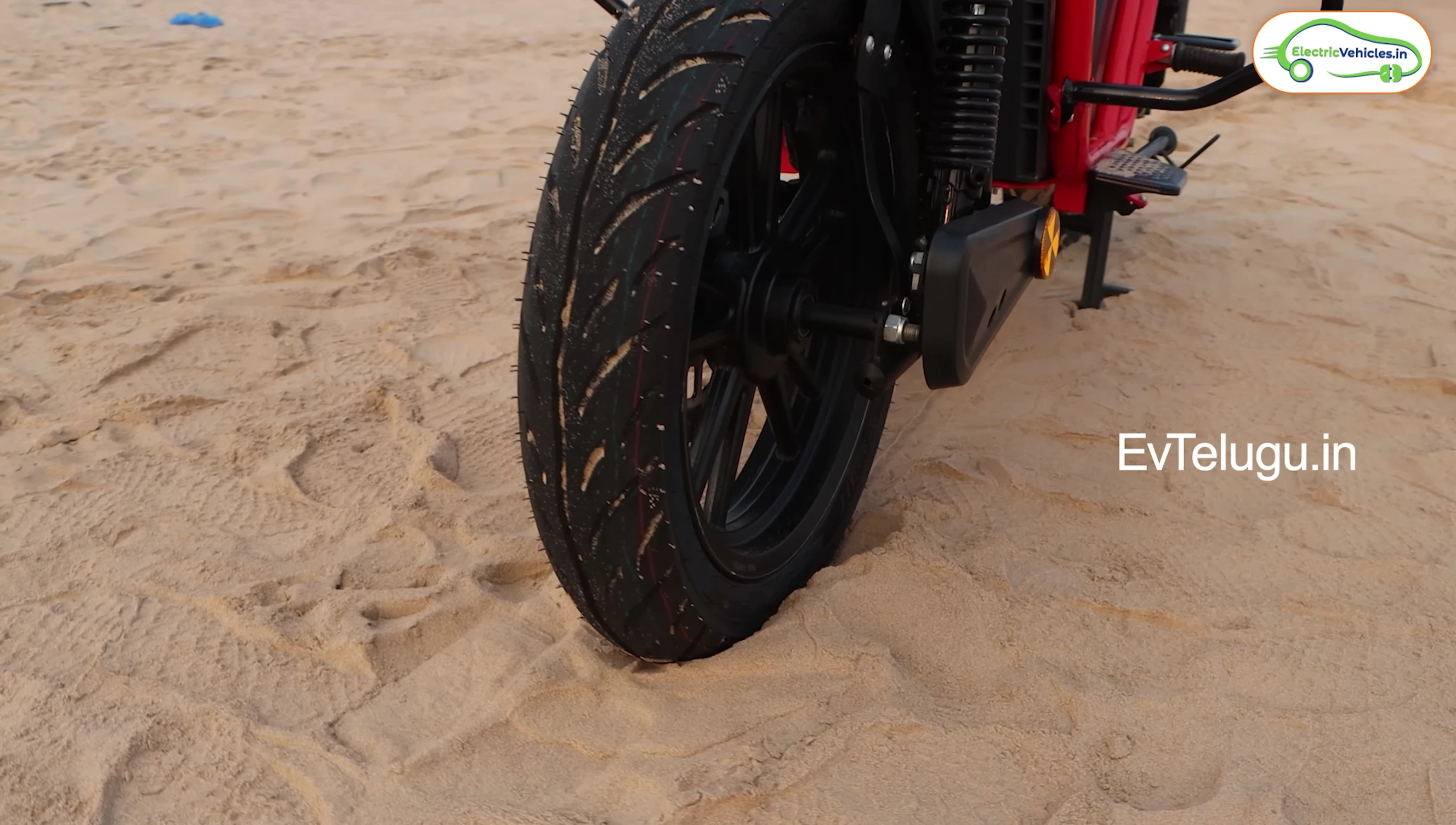 Close-up of the front wheel and tire, highlighting the disc brakes