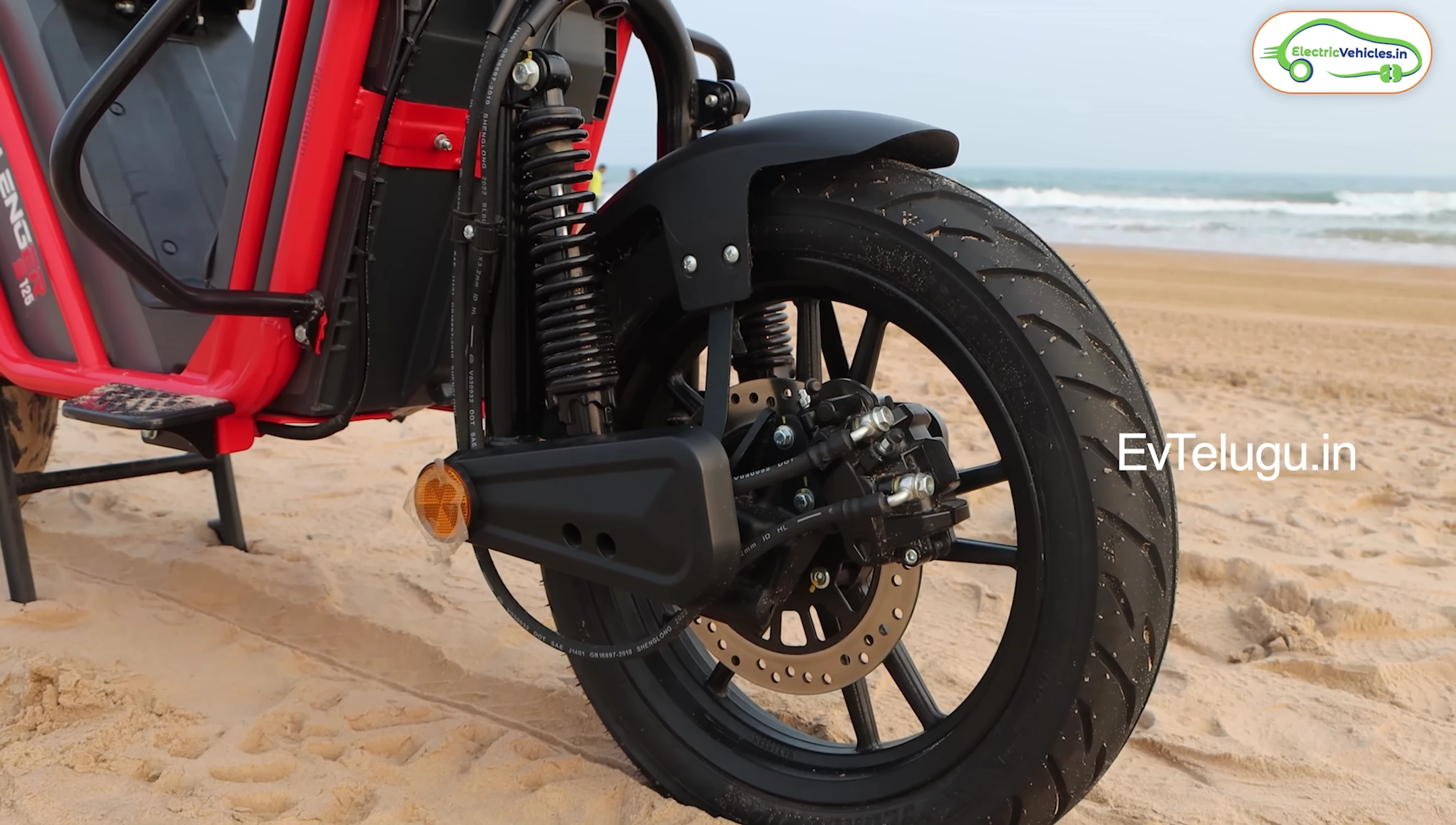 Side view showcasing the protective guards and footrests