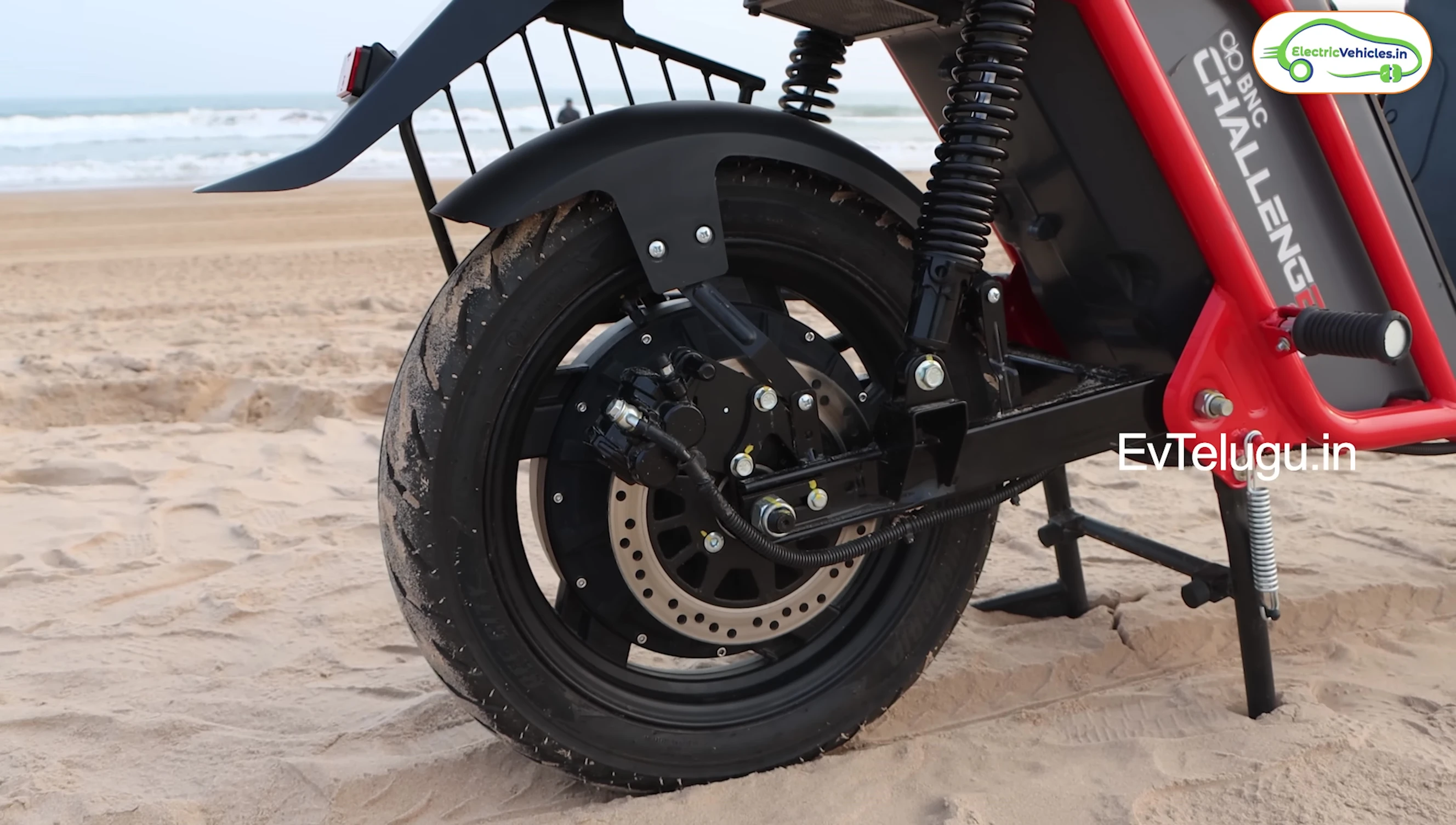 Rear view of the scooter, showing the taillights and mudguard