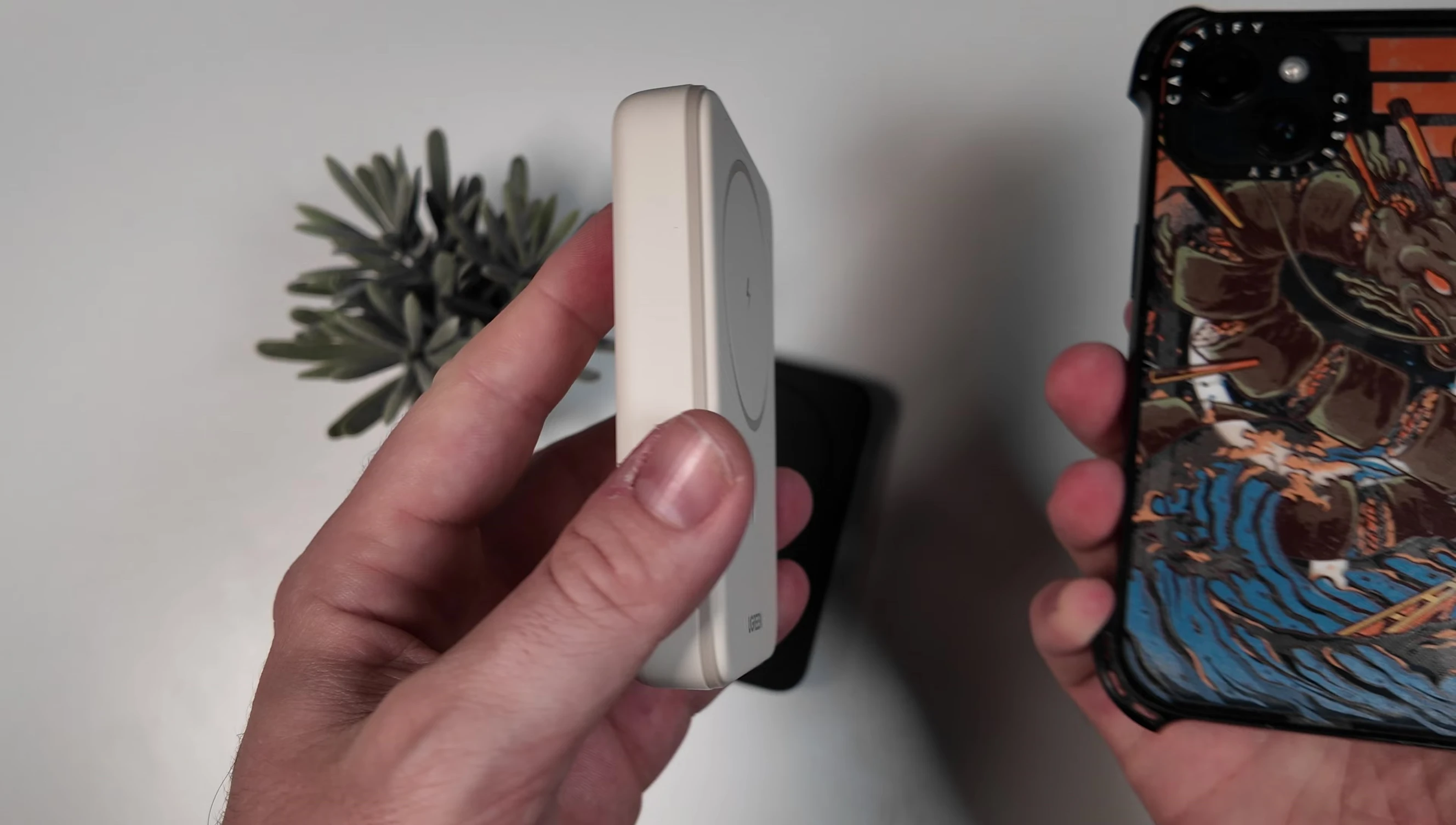 Demonstrating the MagSafe connection to a device