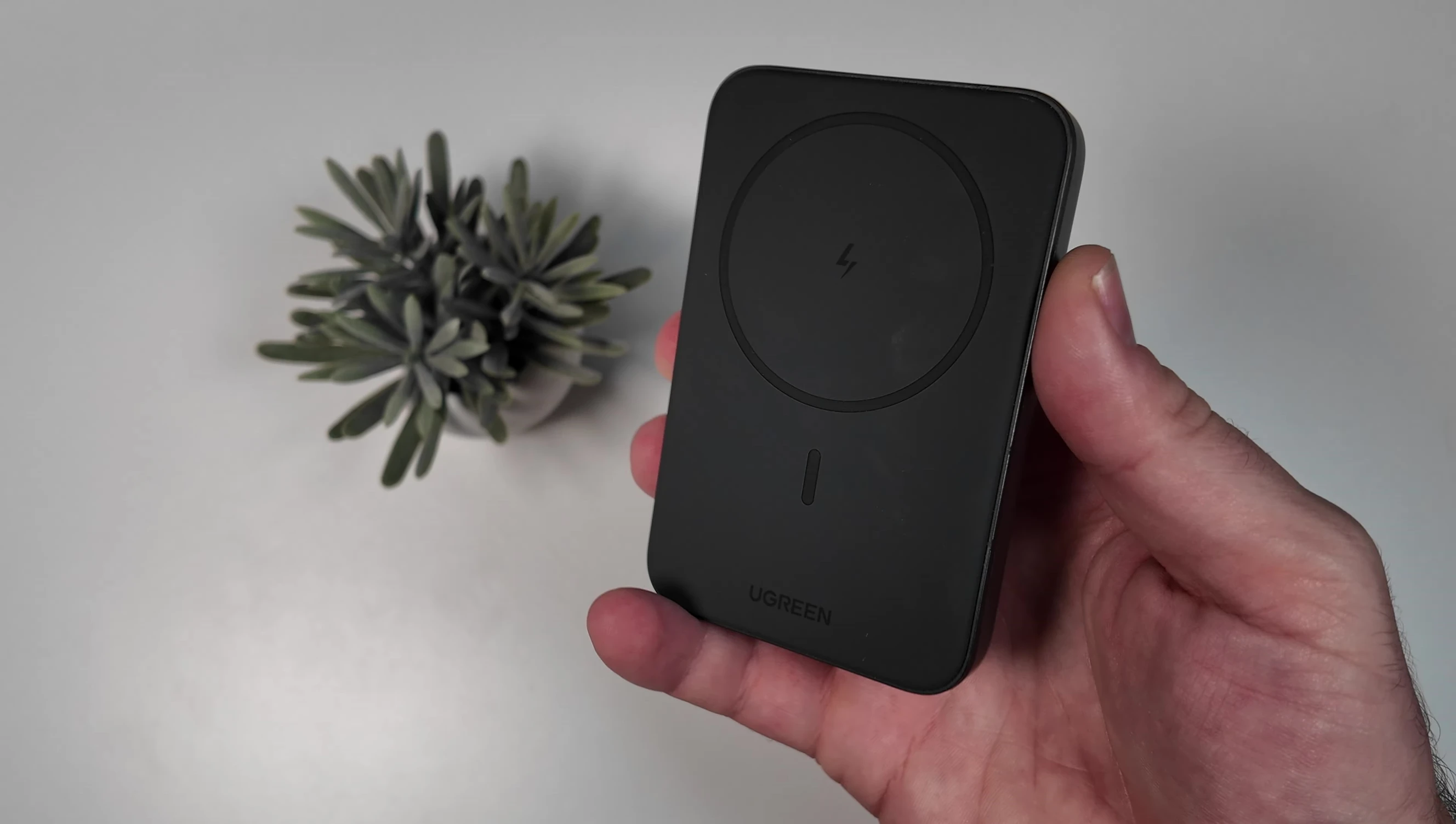 Close-up shot of the black UGREEN MagSafe power bank