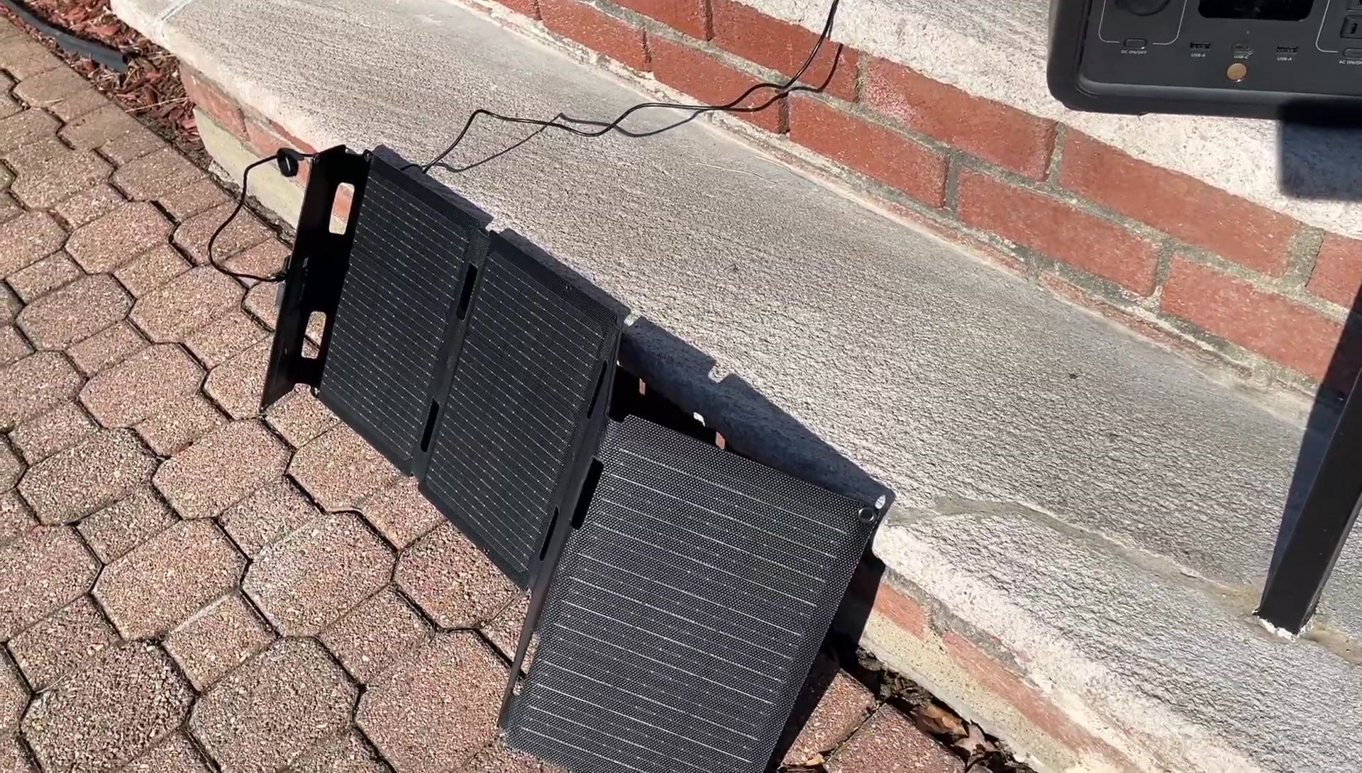 The solar panel connected to the EcoFlow River 2, showing low wattage input.