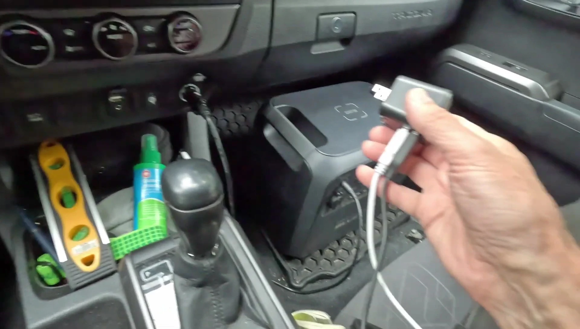 Bluetti AC180 next to the bed in a camper van