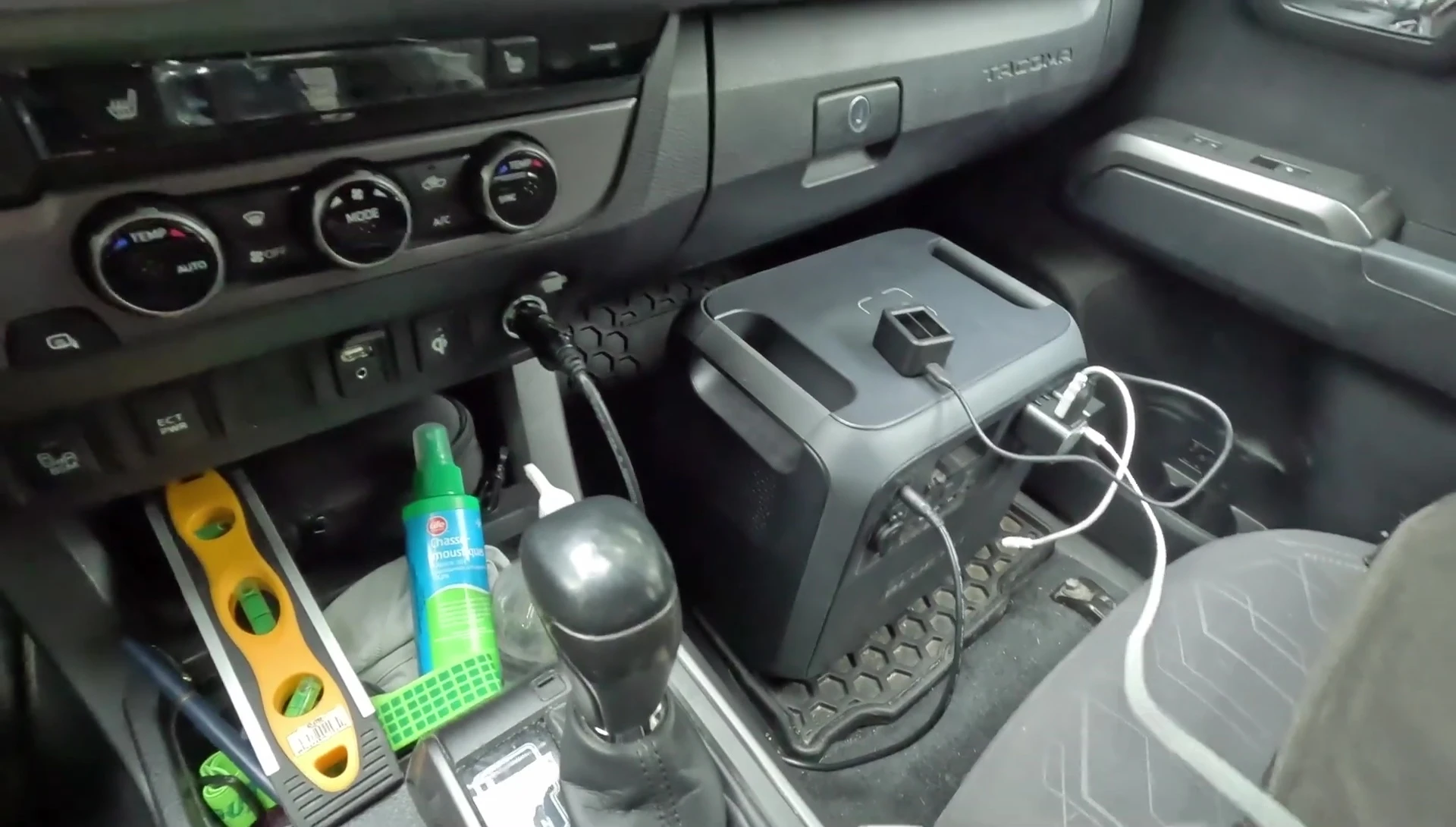 USB outlets and charging cables connected to the Bluetti AC180
