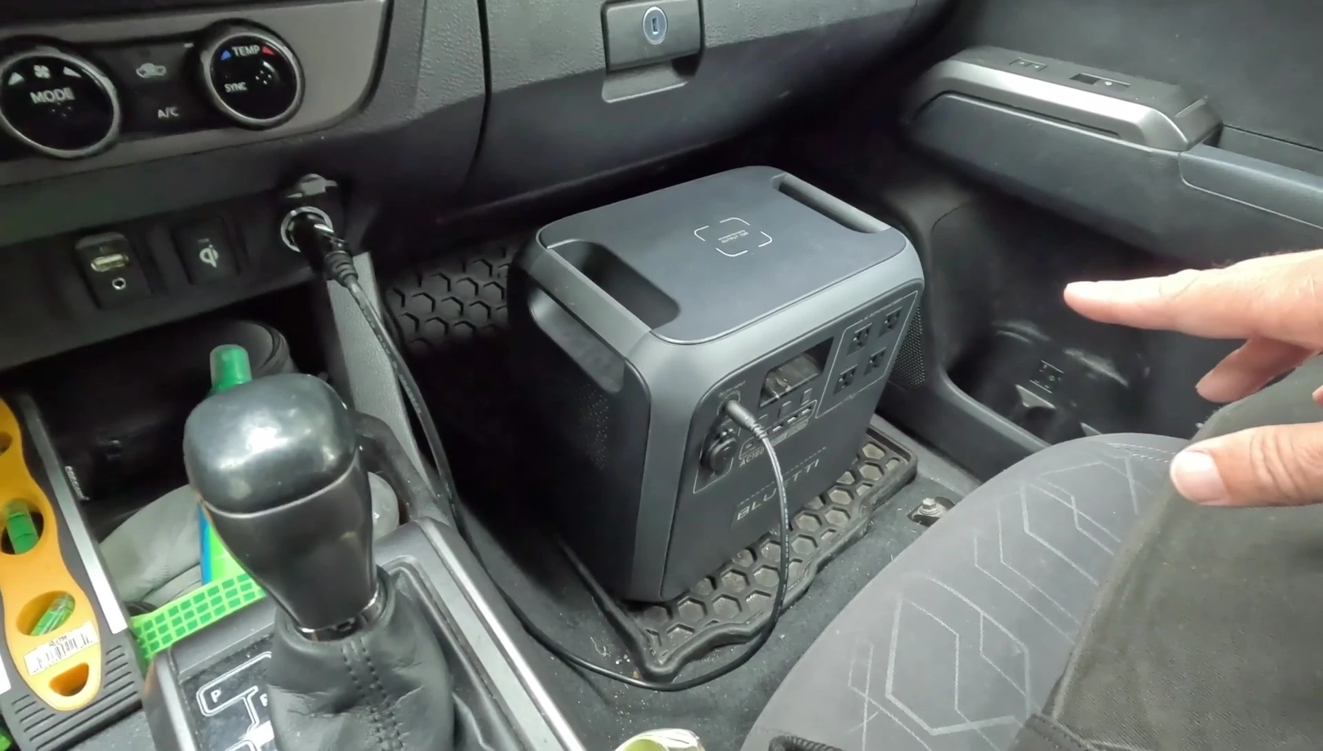 Bluetti AC180 in the passenger seat of a vehicle