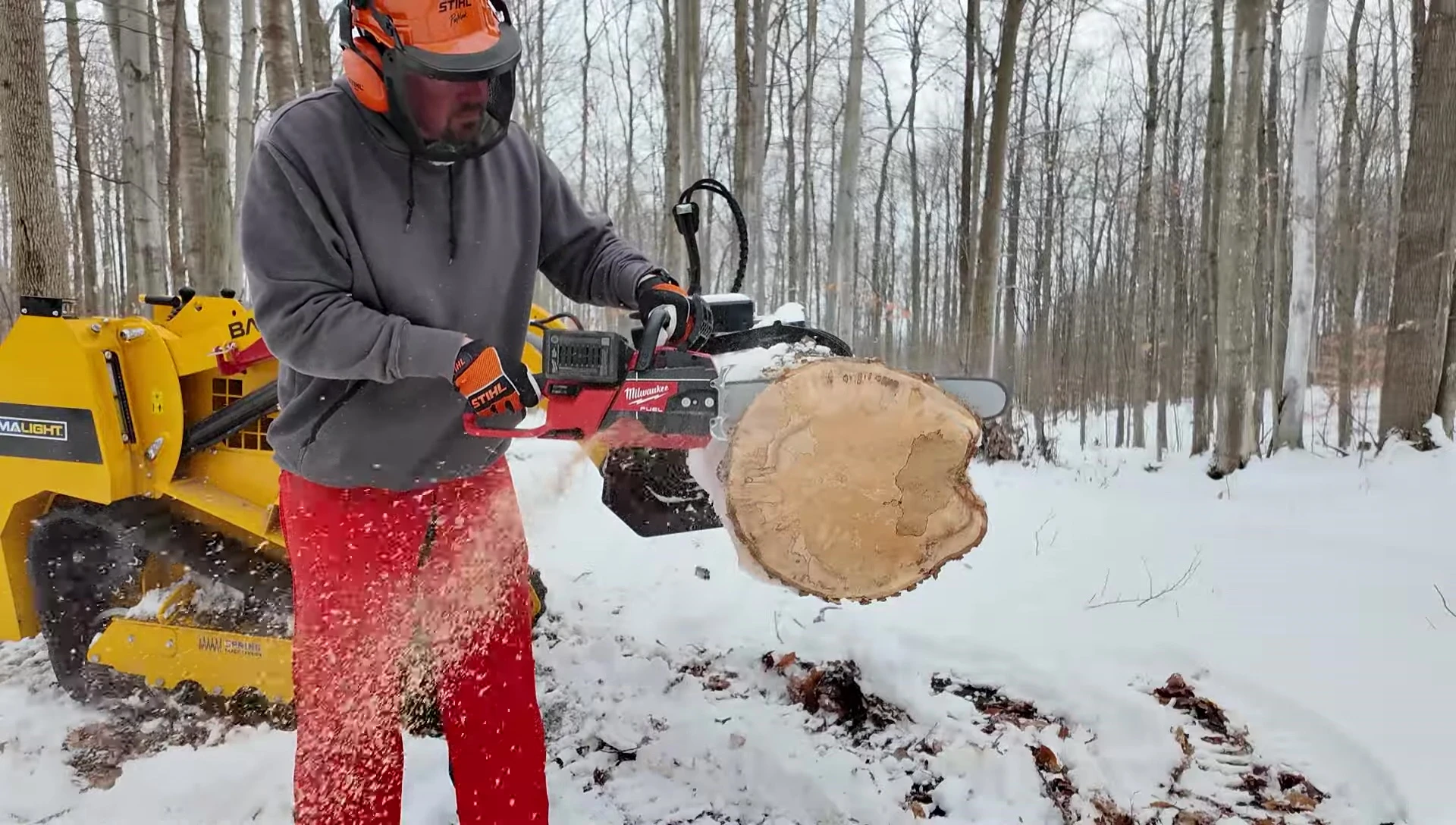 The reviewer offering a final assessment of battery-powered chainsaws.