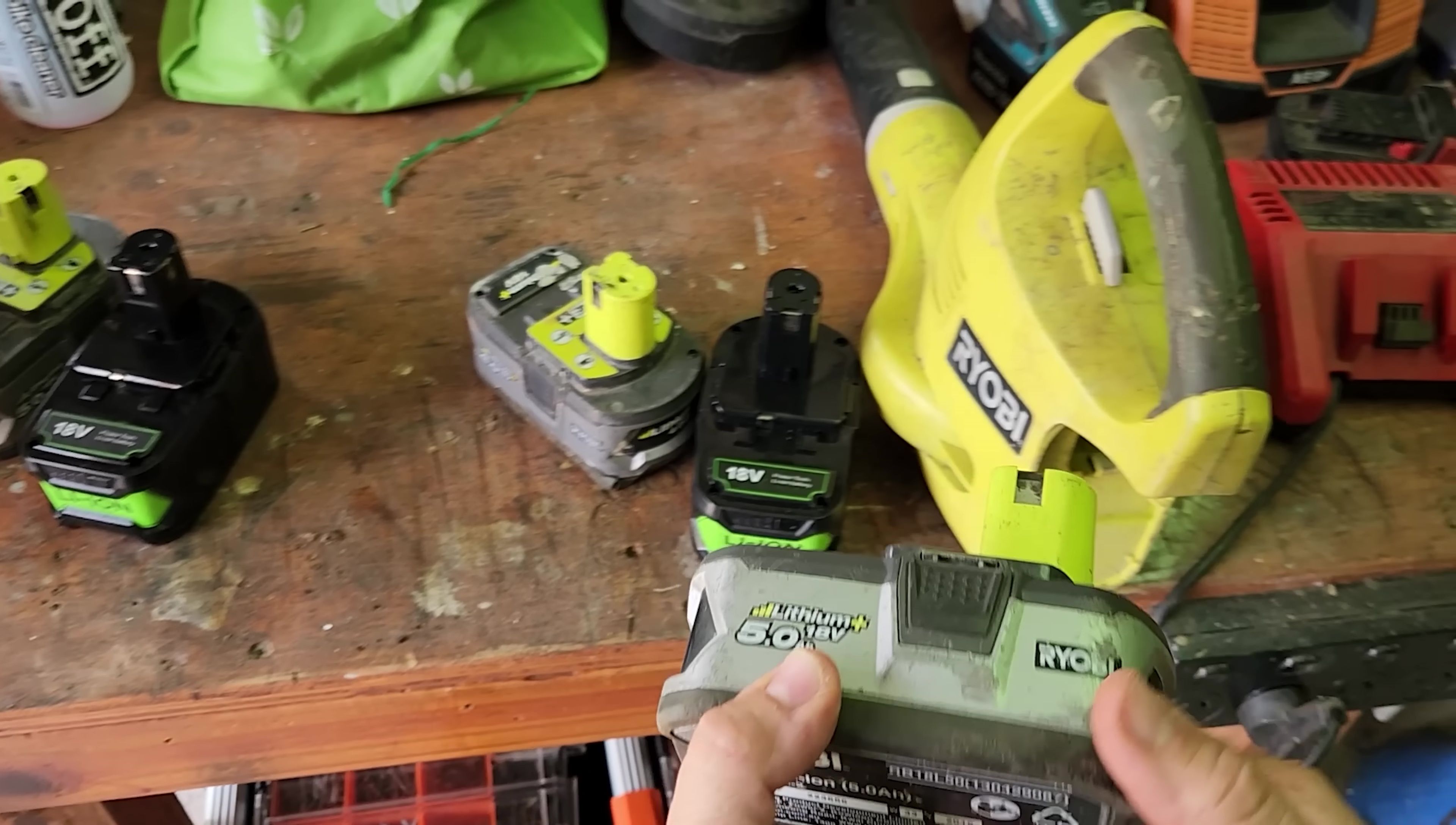 Screenshot showing the speaker testing the third-party battery in a leaf blower.