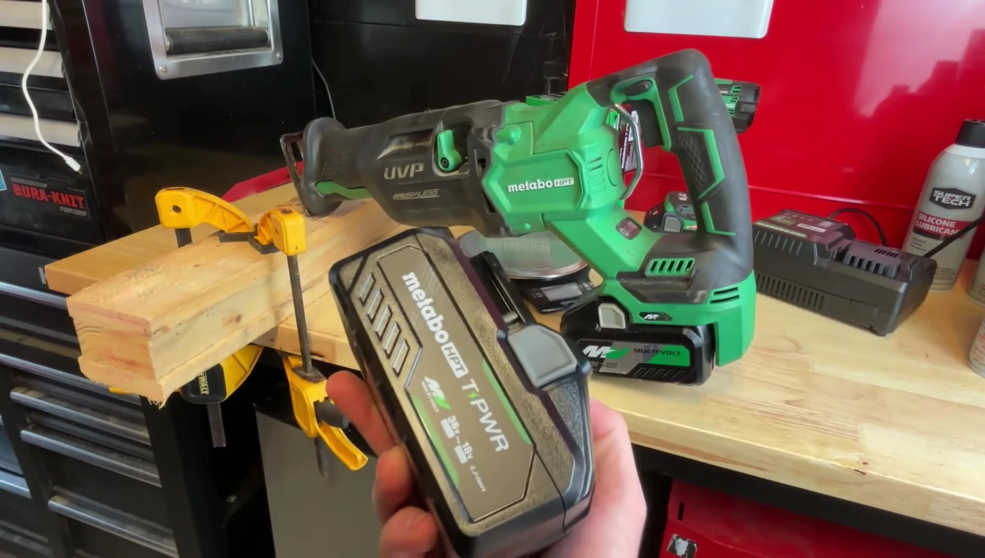 Reciprocating saw cutting through wood