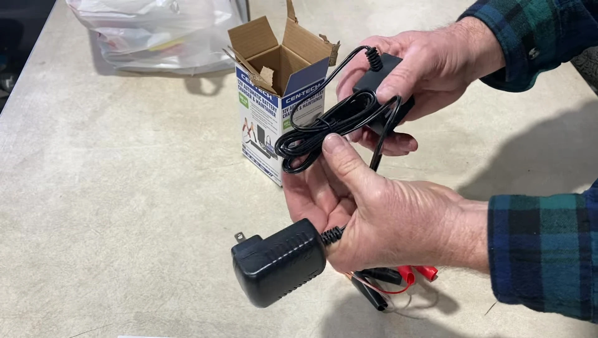 Close-up of the battery tender's clamps and cord