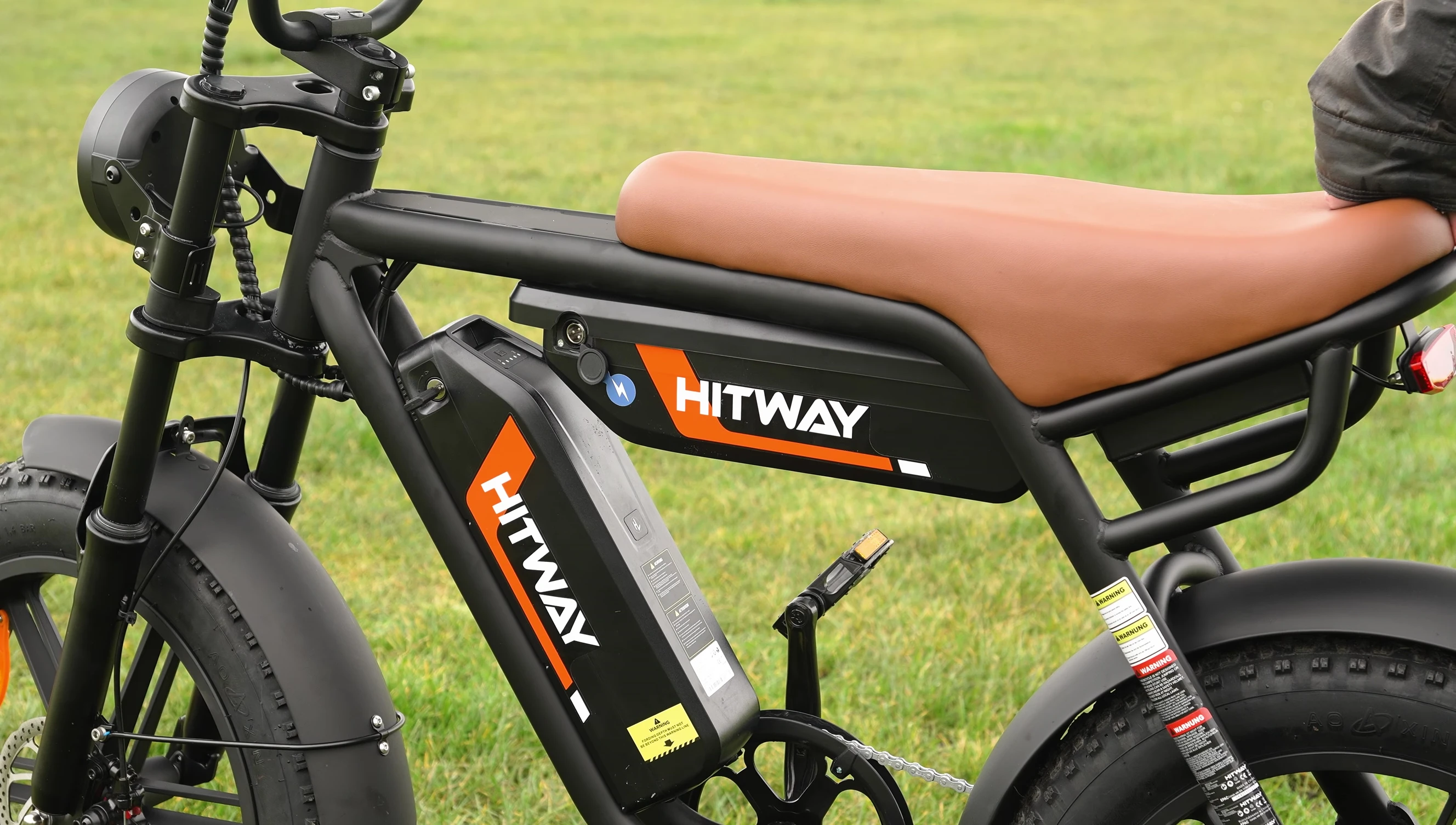 Demonstrating the removal of a battery from the bike.