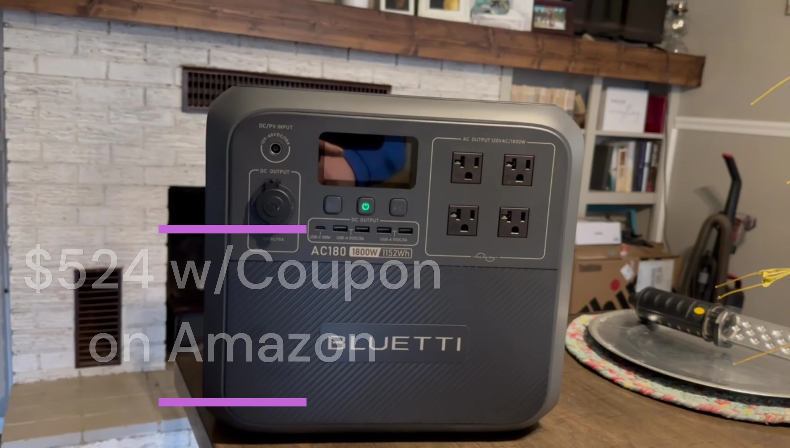 The reviewer holding the Bluetti AC180 Power Station