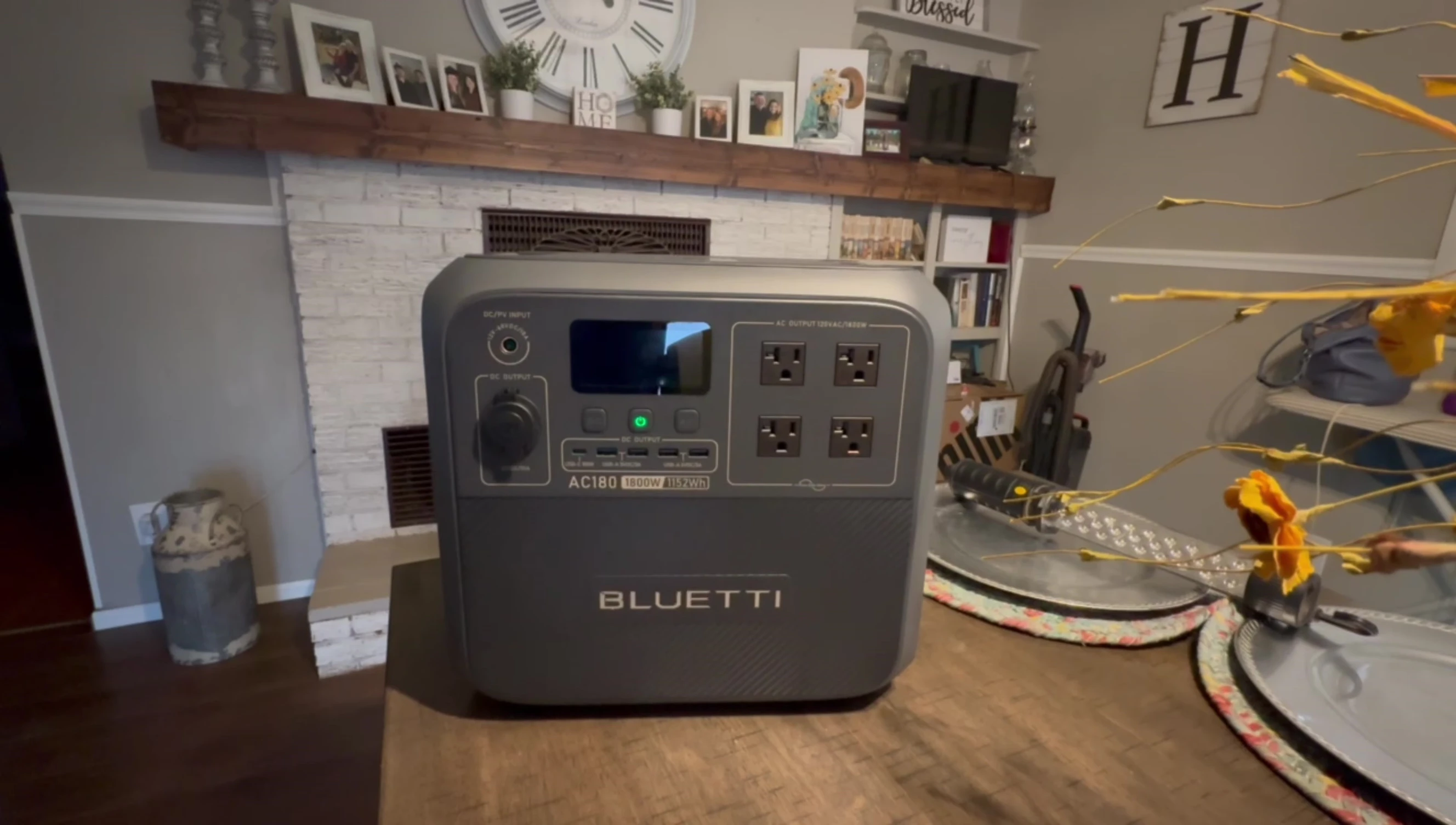 The reviewer pressing the power button on the Bluetti AC180