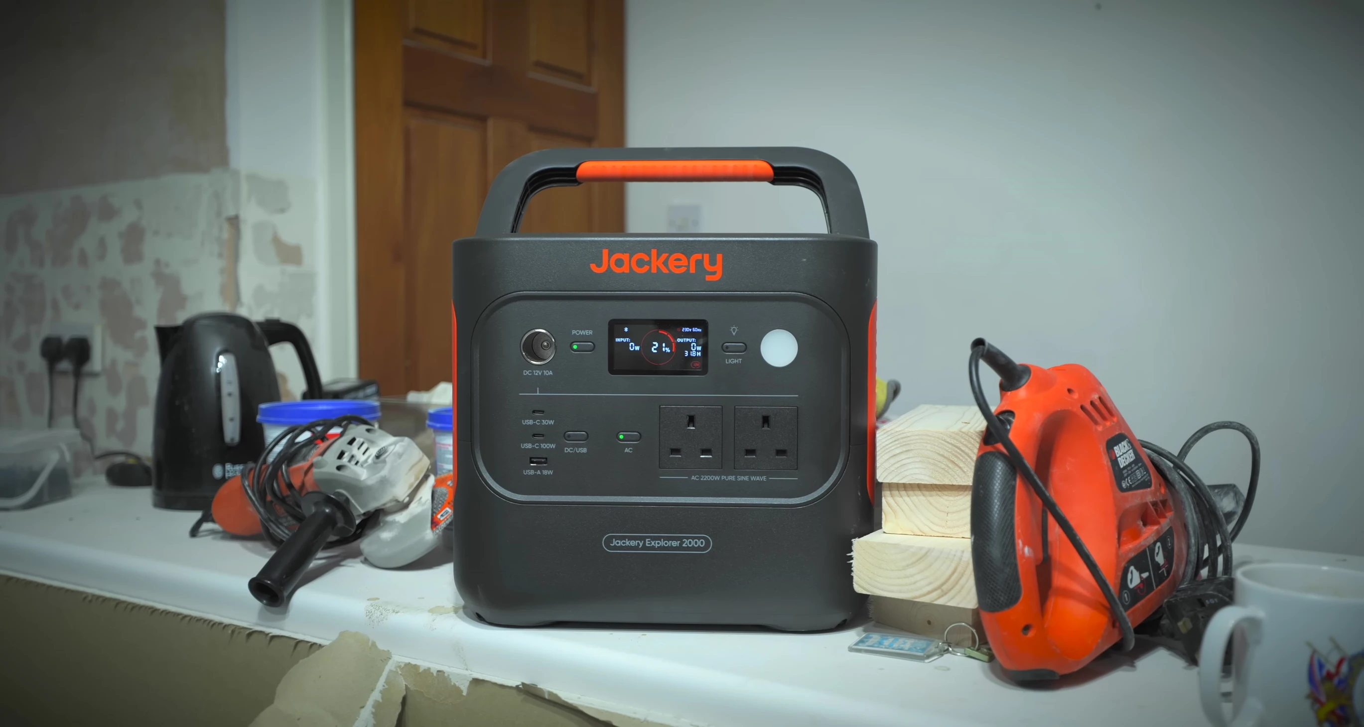 Close-up of the Jackery Explorer 2000 v2 showing the orange accents and large handle.