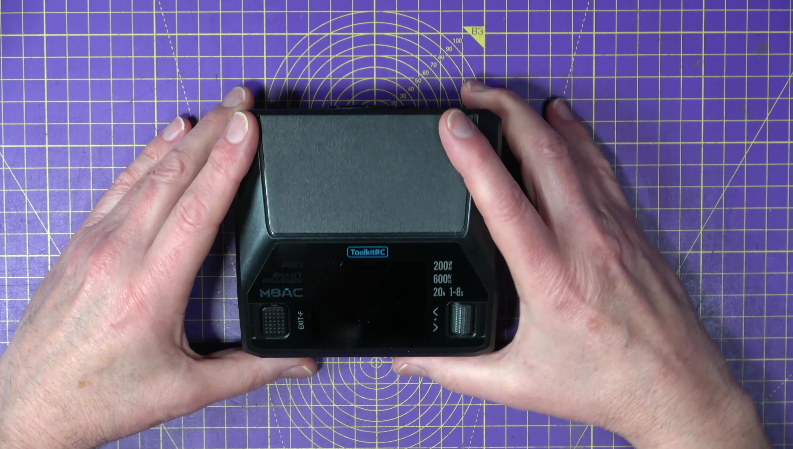 The M8AC charger plugged into an AC outlet.