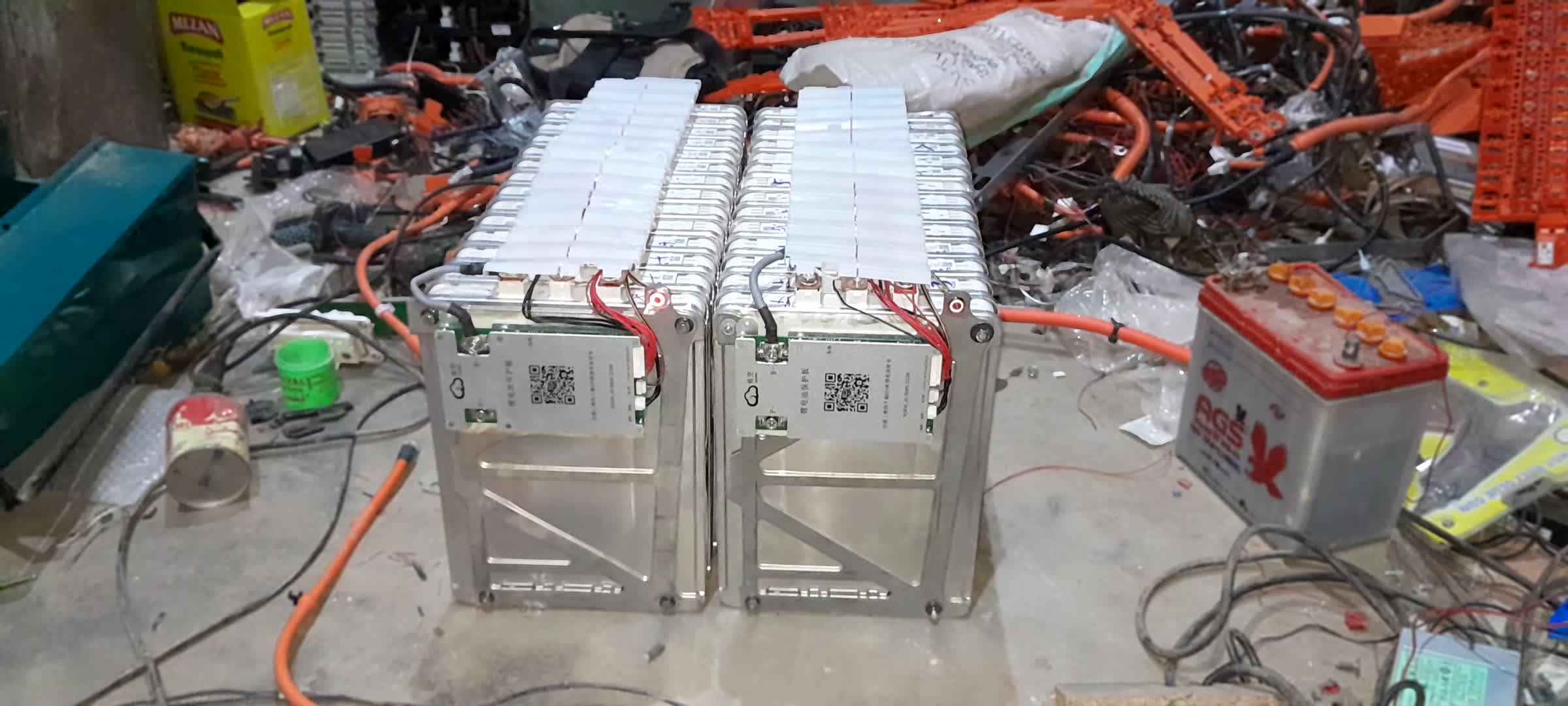 Close-up shot of the two 24V batteries being assembled.