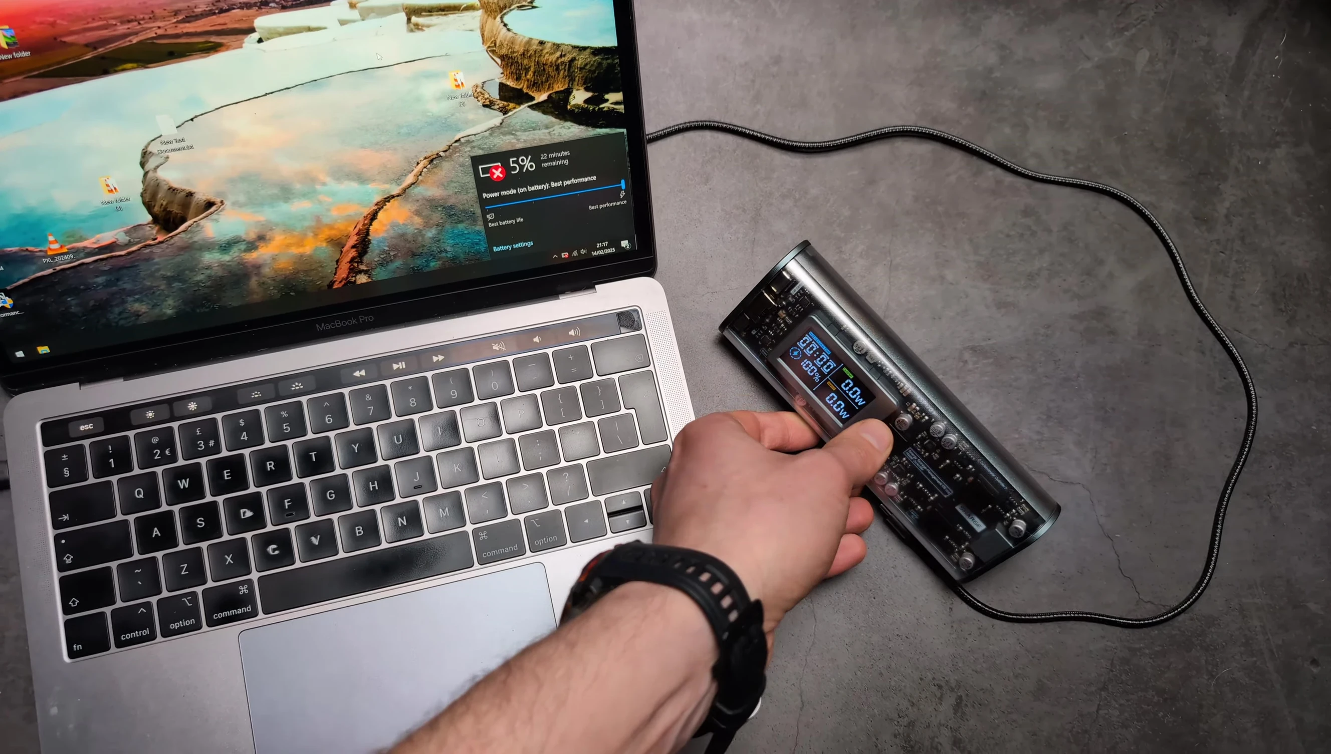 The power bank charging a MacBook Pro