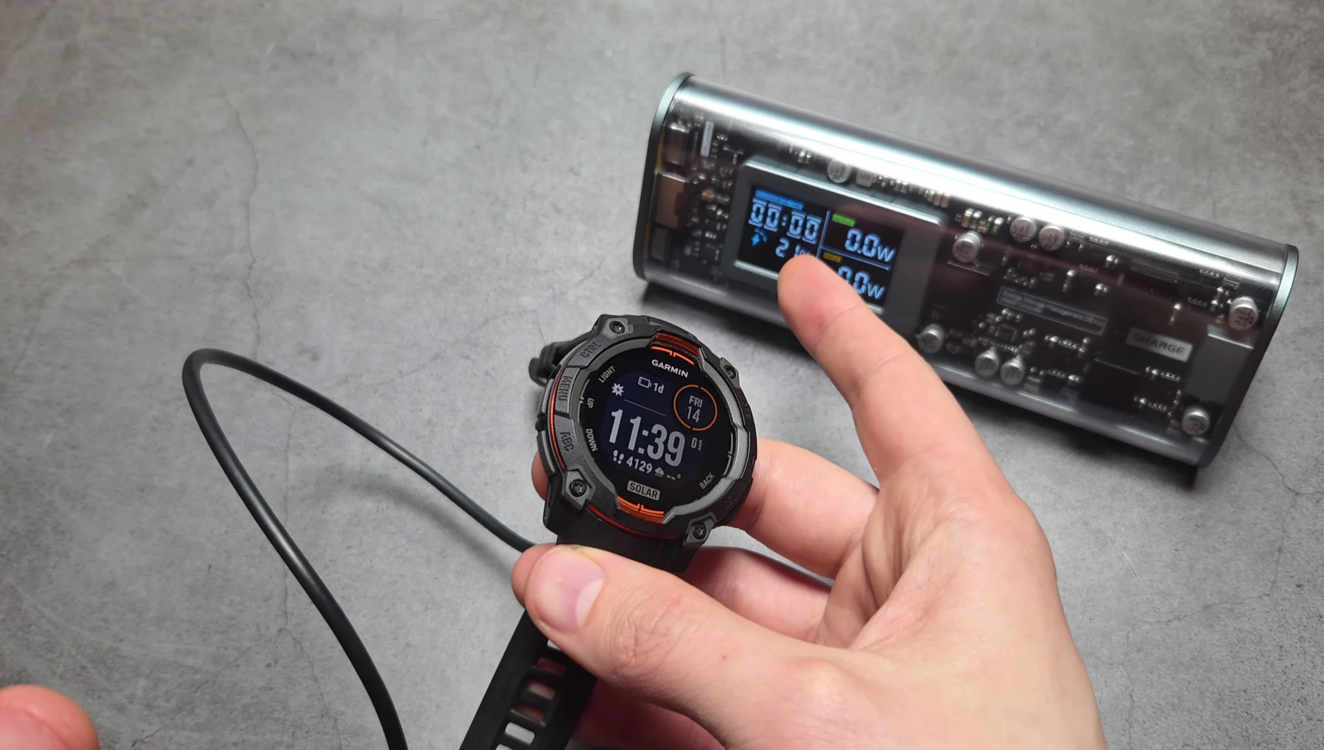 The power bank charging a smartwatch