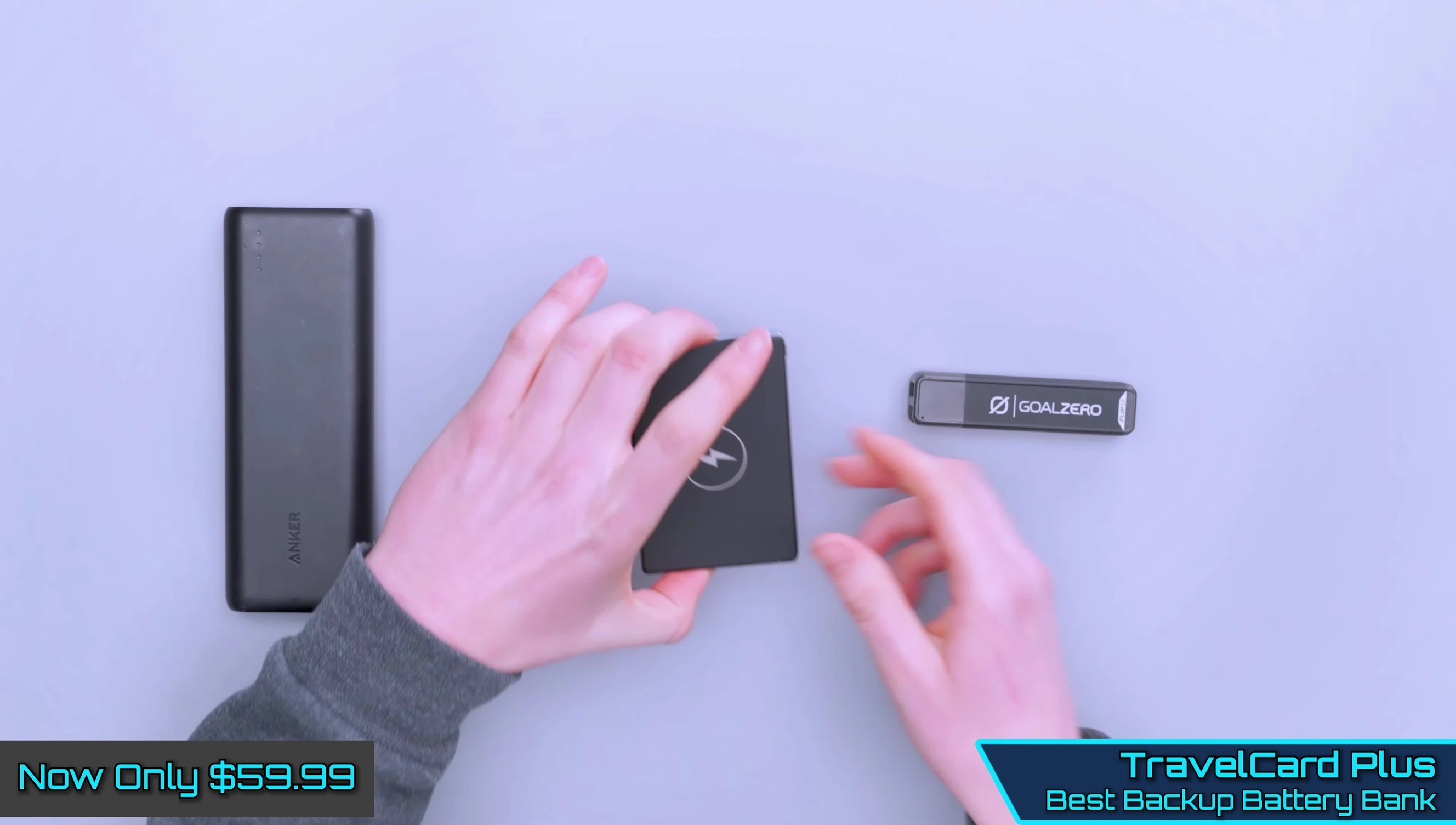 Travel Card Plus battery bank shown next to credit cards, highlighting its slim profile.