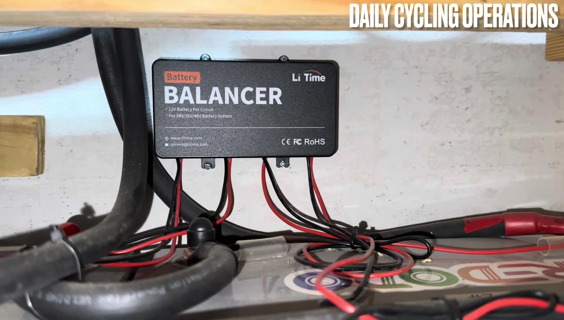 A LiTime battery balancer already installed on a battery bank
