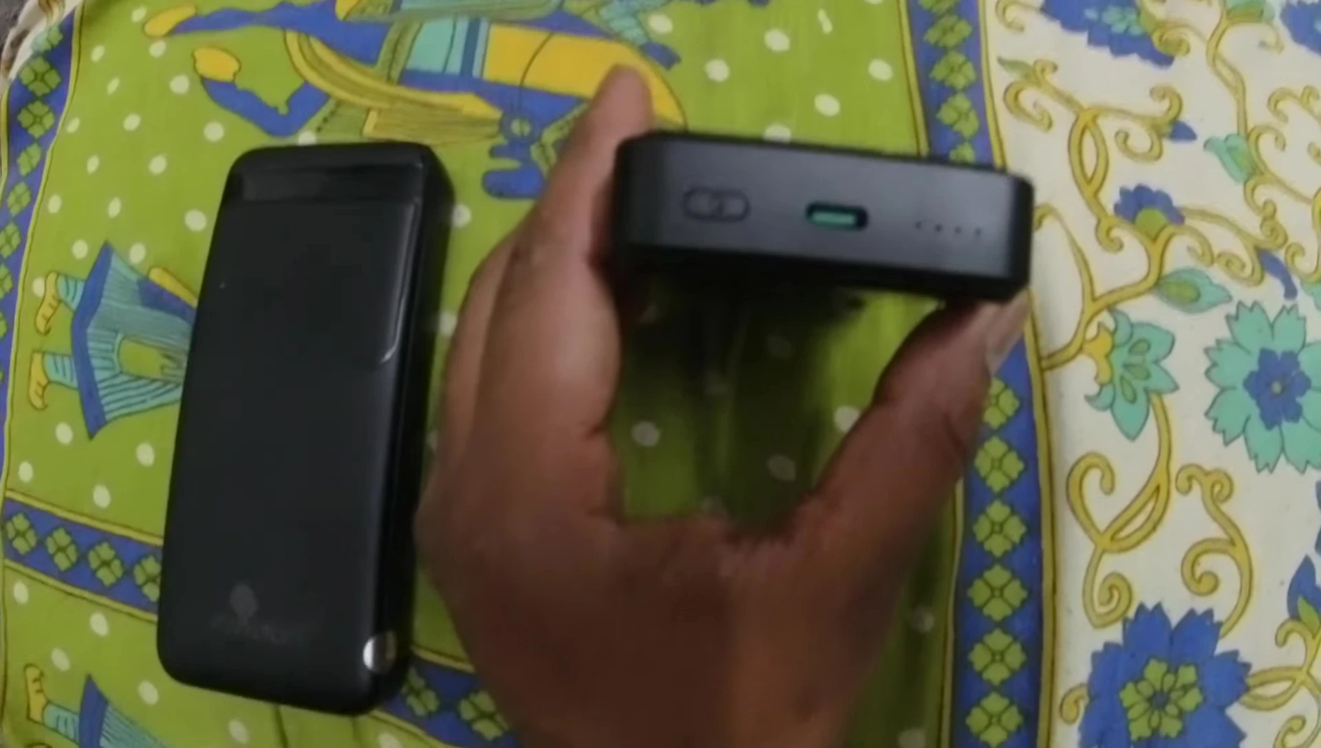 Close-up of the top of the power bank showing the USB-C port, power button, and battery indicator.