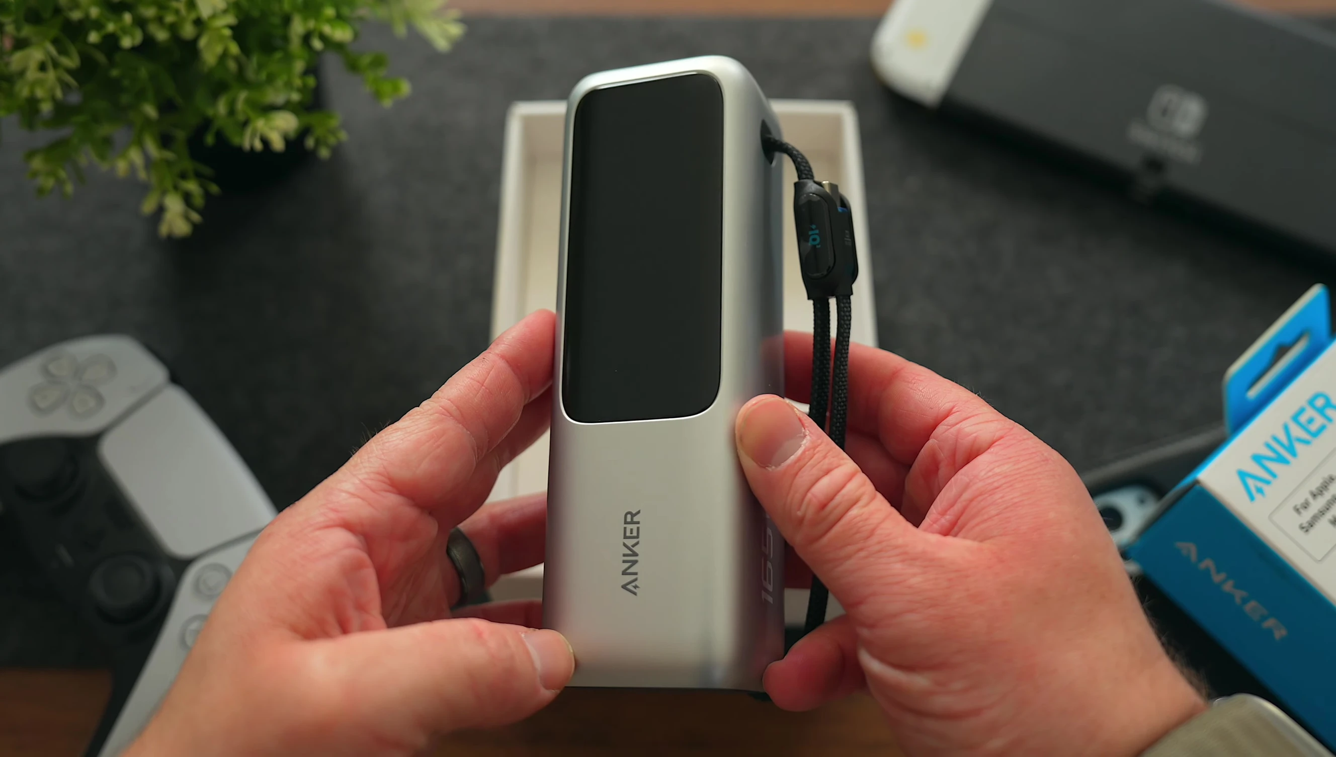 The power bank shown alongside other items to show its size.