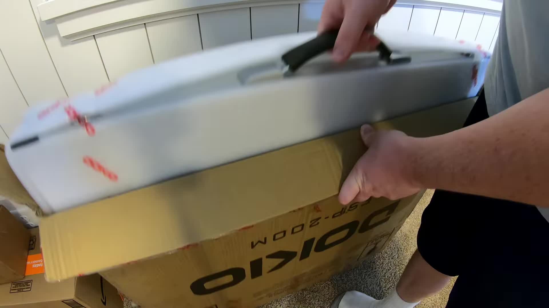 The DOKIO 200W solar panel in its packaging.