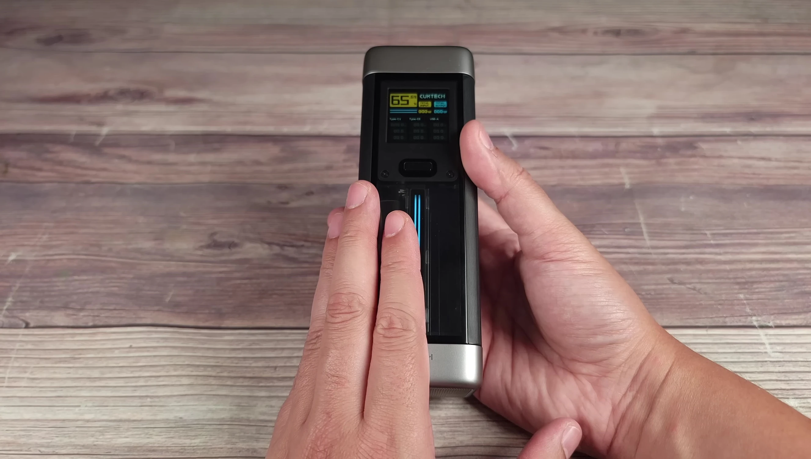 The CUKTECH 20 charging a MacBook Pro.