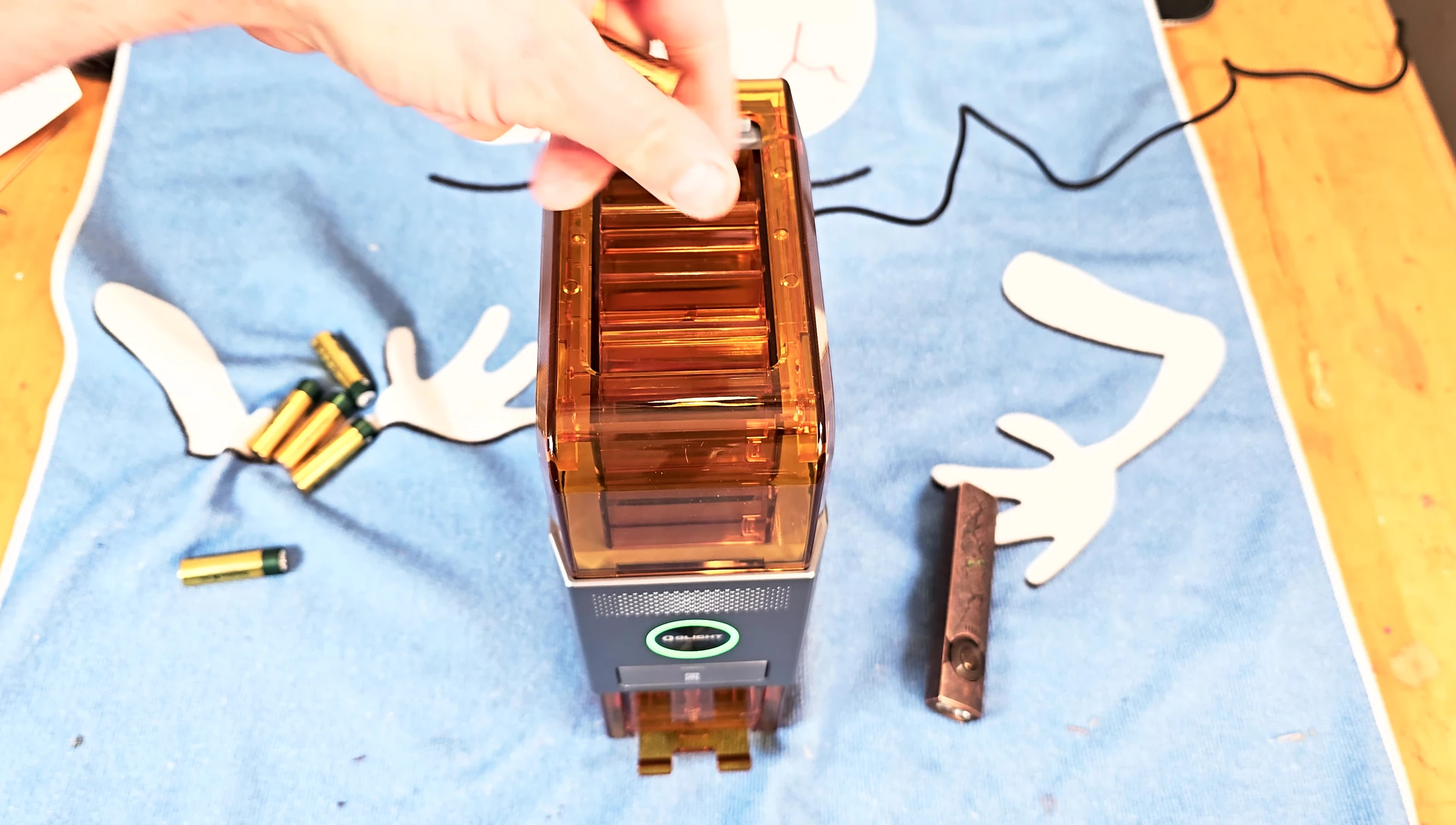 Demonstrating the random insertion of batteries.
