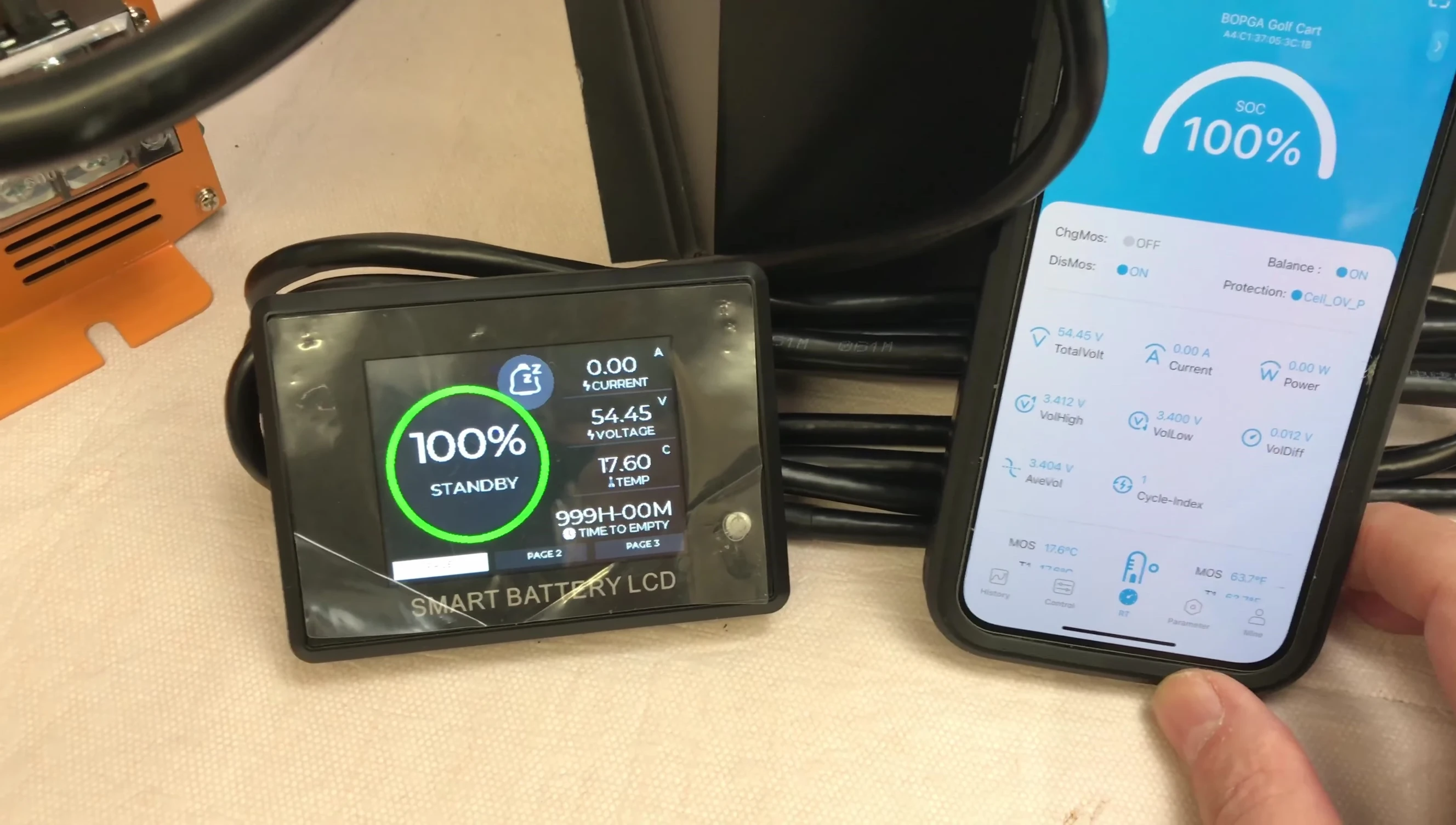 Fully charged battery connected to the discharge testing setup.