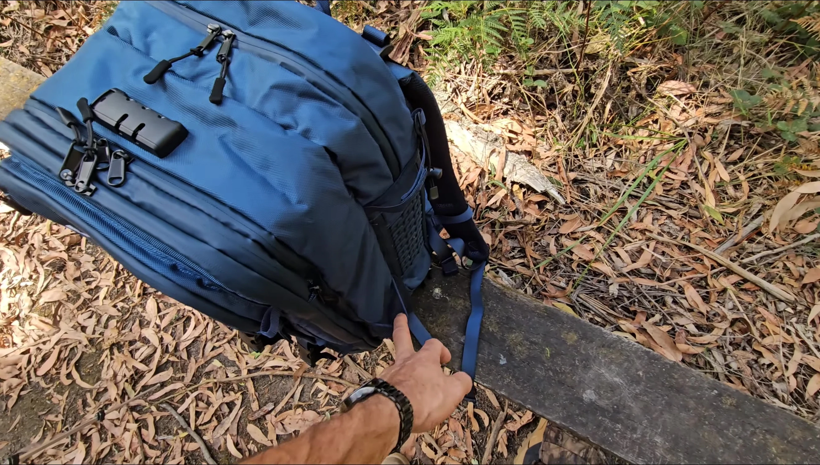 View of the side of the backpack with drink bottle holders and other smaller features.