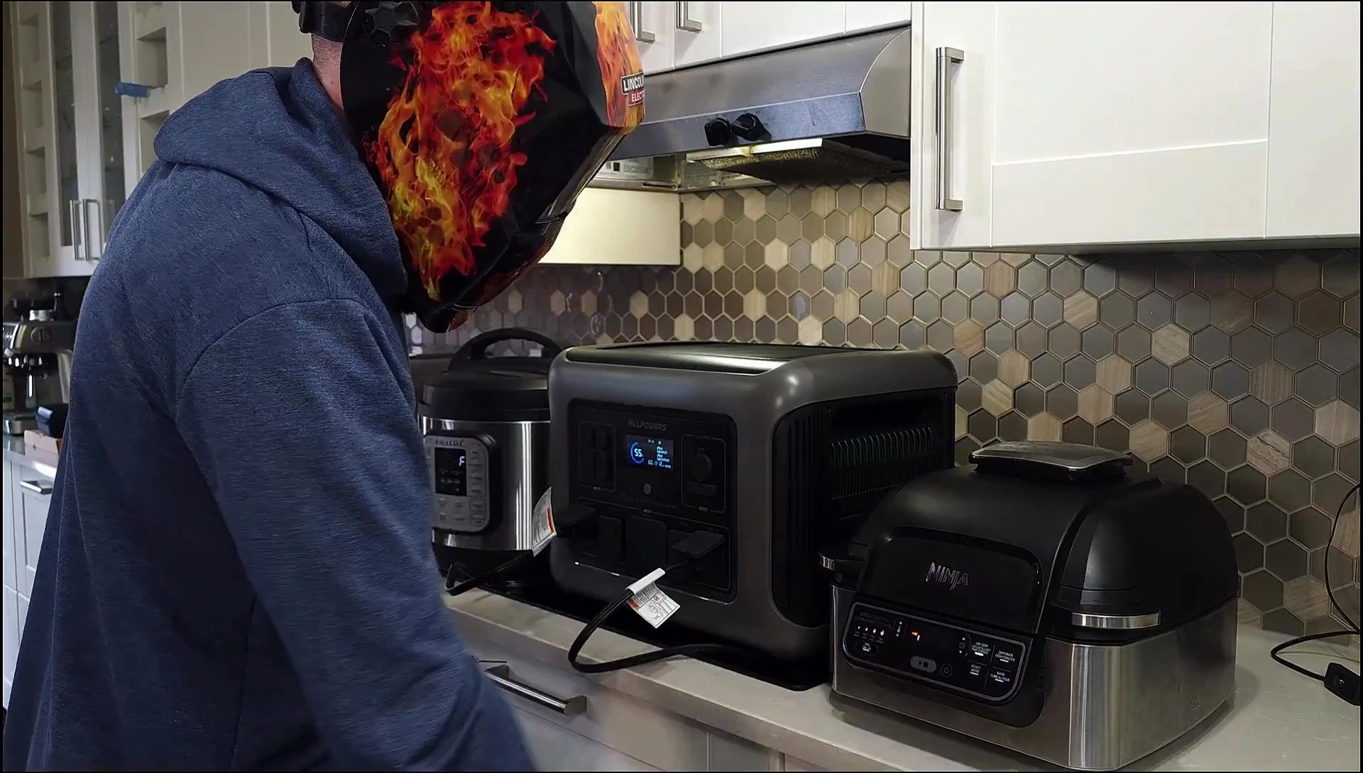 Multiple appliances connected to the ALLPOWERS R2500 during high-power testing.