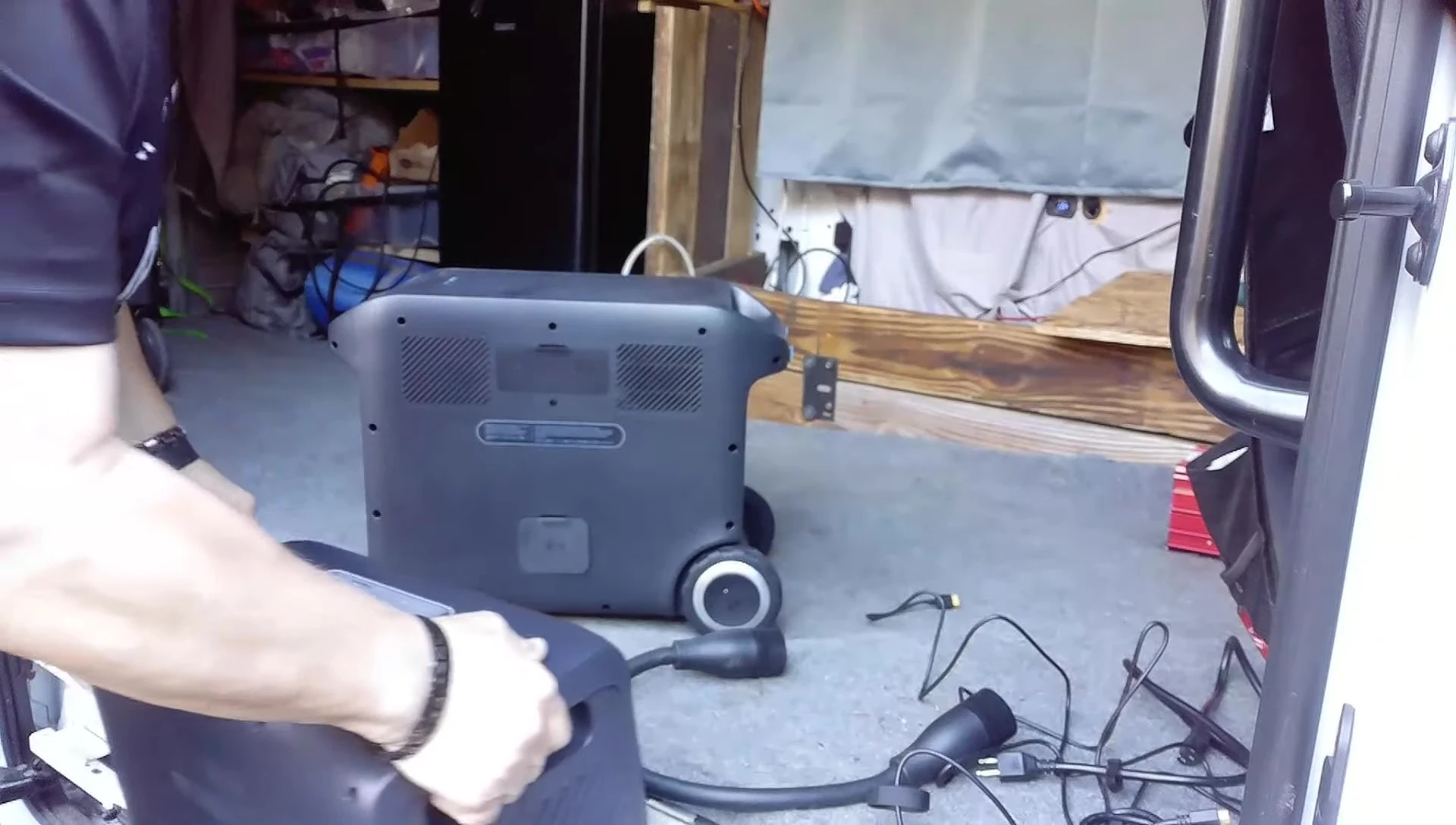 The external battery with handle.