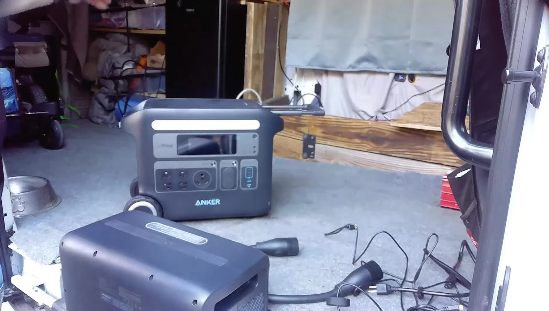 The reviewer using the power station to power a microwave.