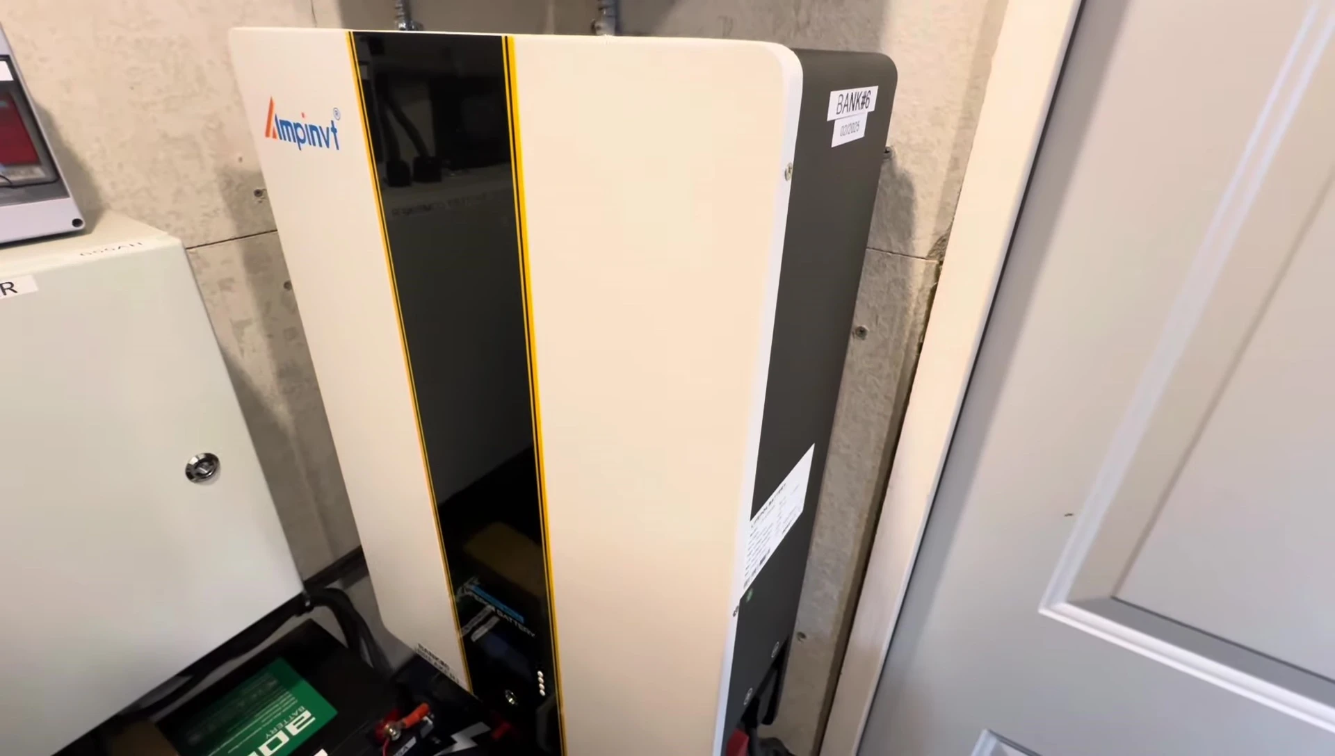 The Ampinvt power wall battery sitting on the floor