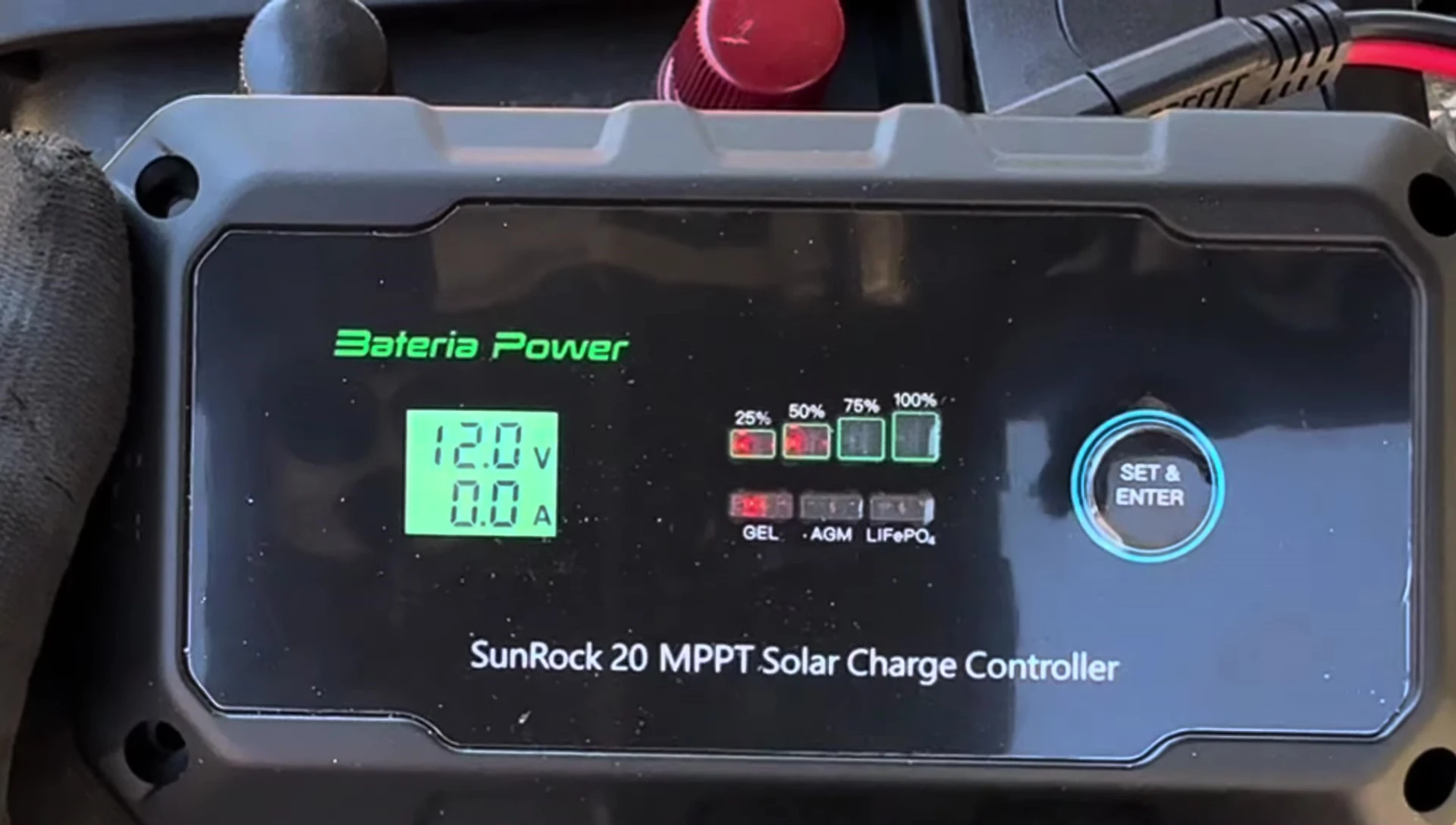 The charge controller's display showing the initial voltage reading.