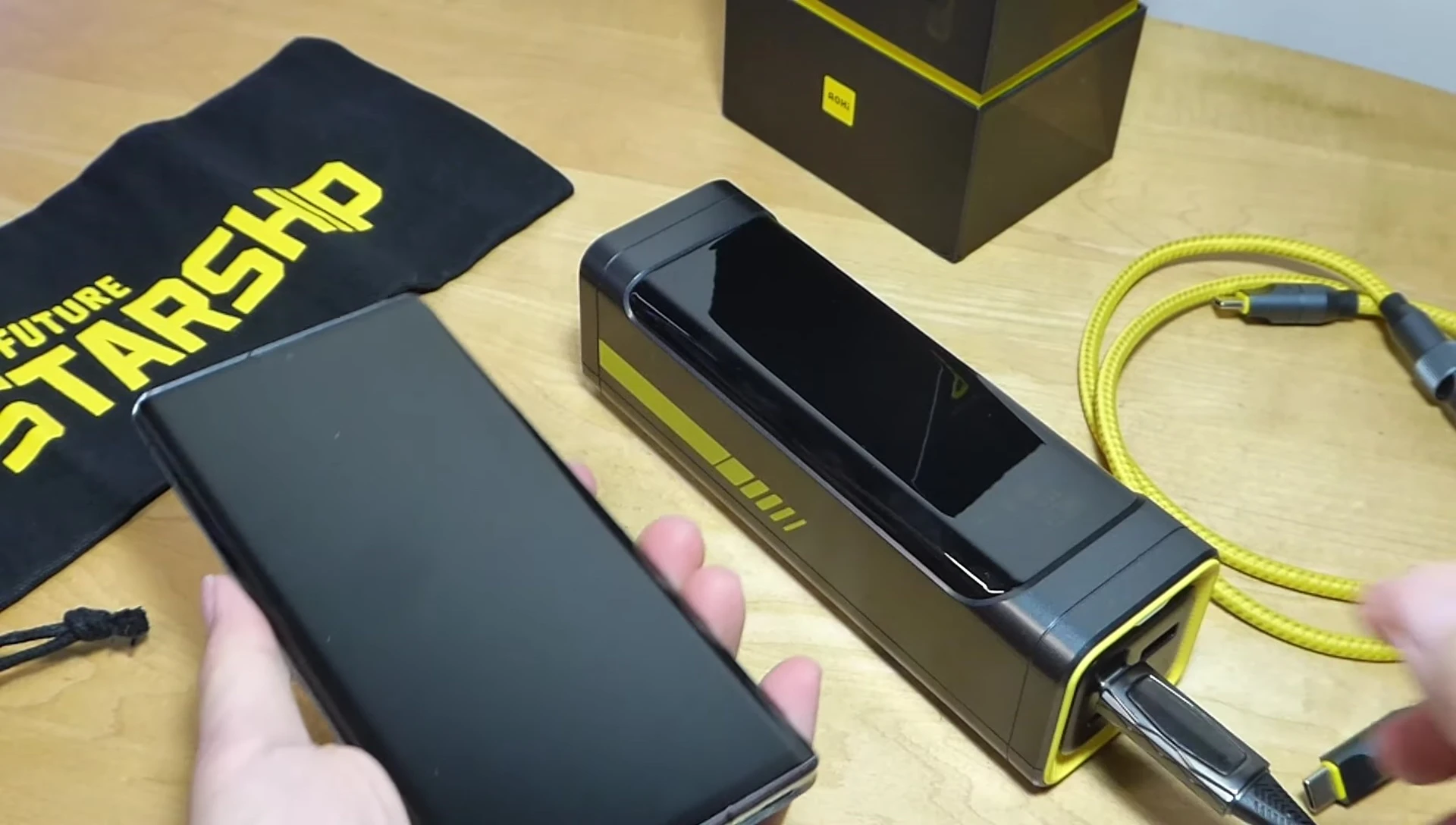 AOHI Starship 240W Power Bank charging a smartphone