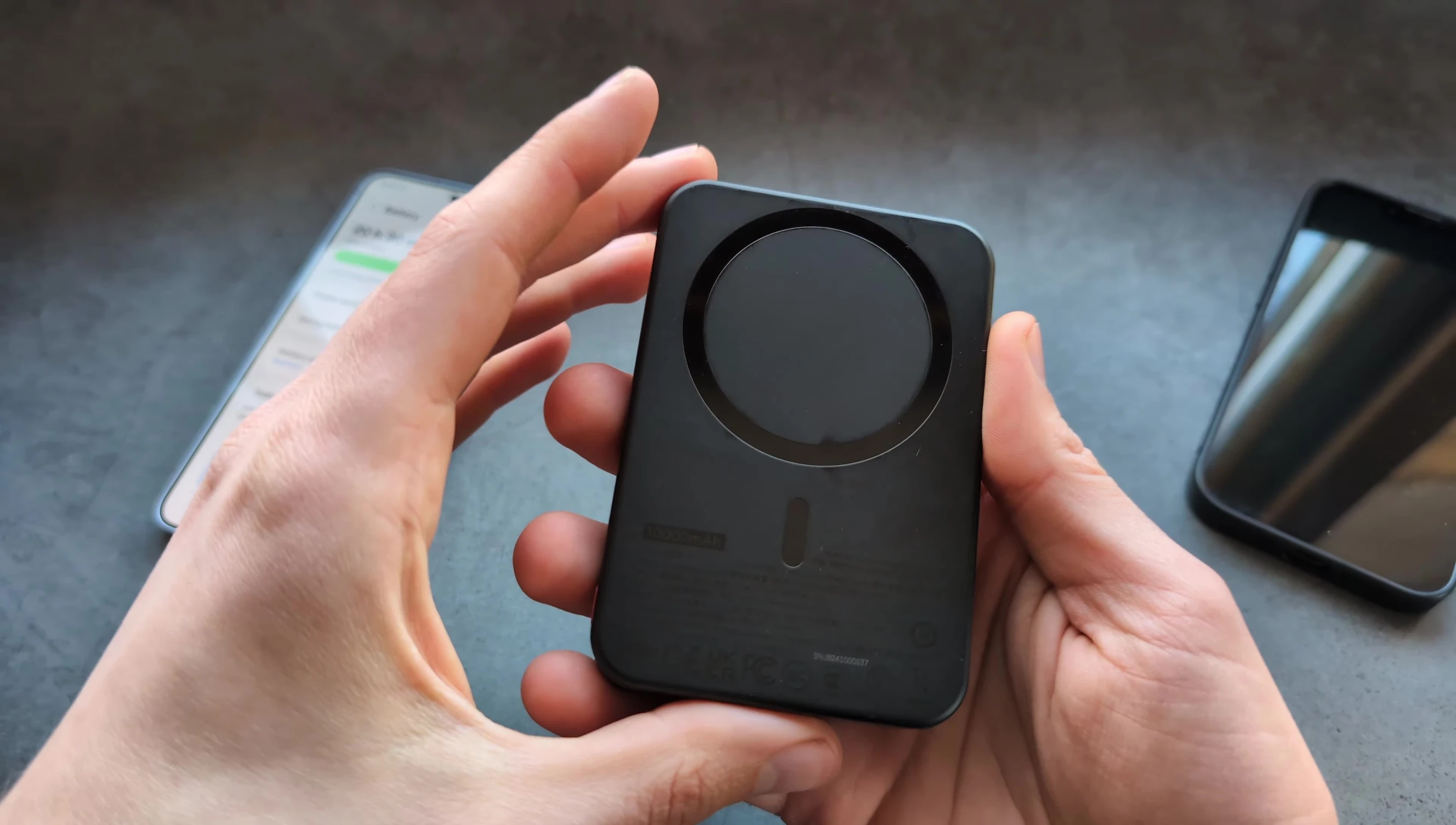Close-up of the power bank ports and button