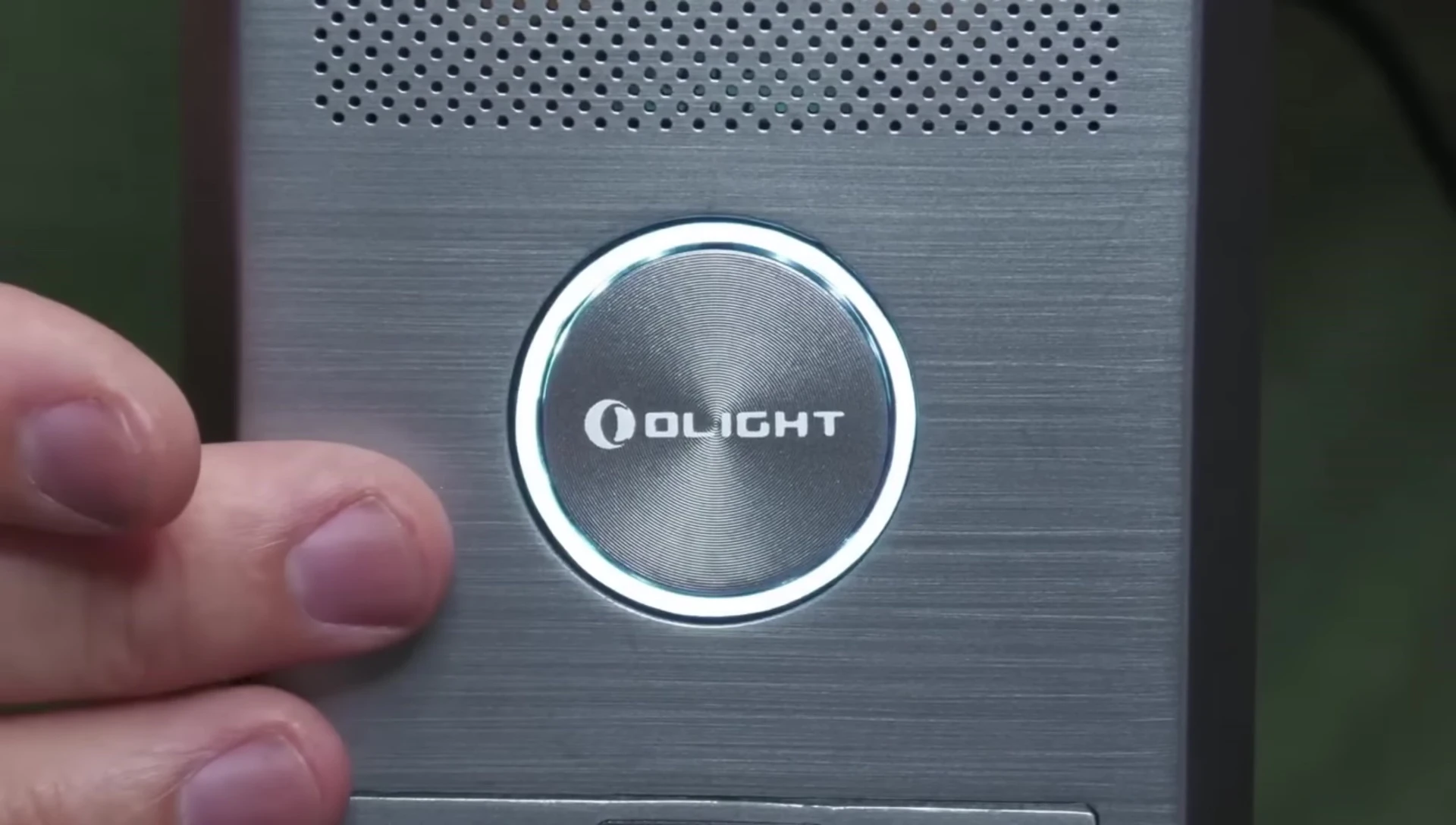 The Olight OStation X displaying a white light, indicating initialization.